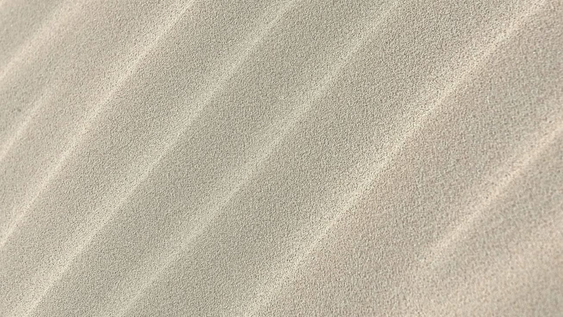 Textura de ondas de arena con rayos de luz
