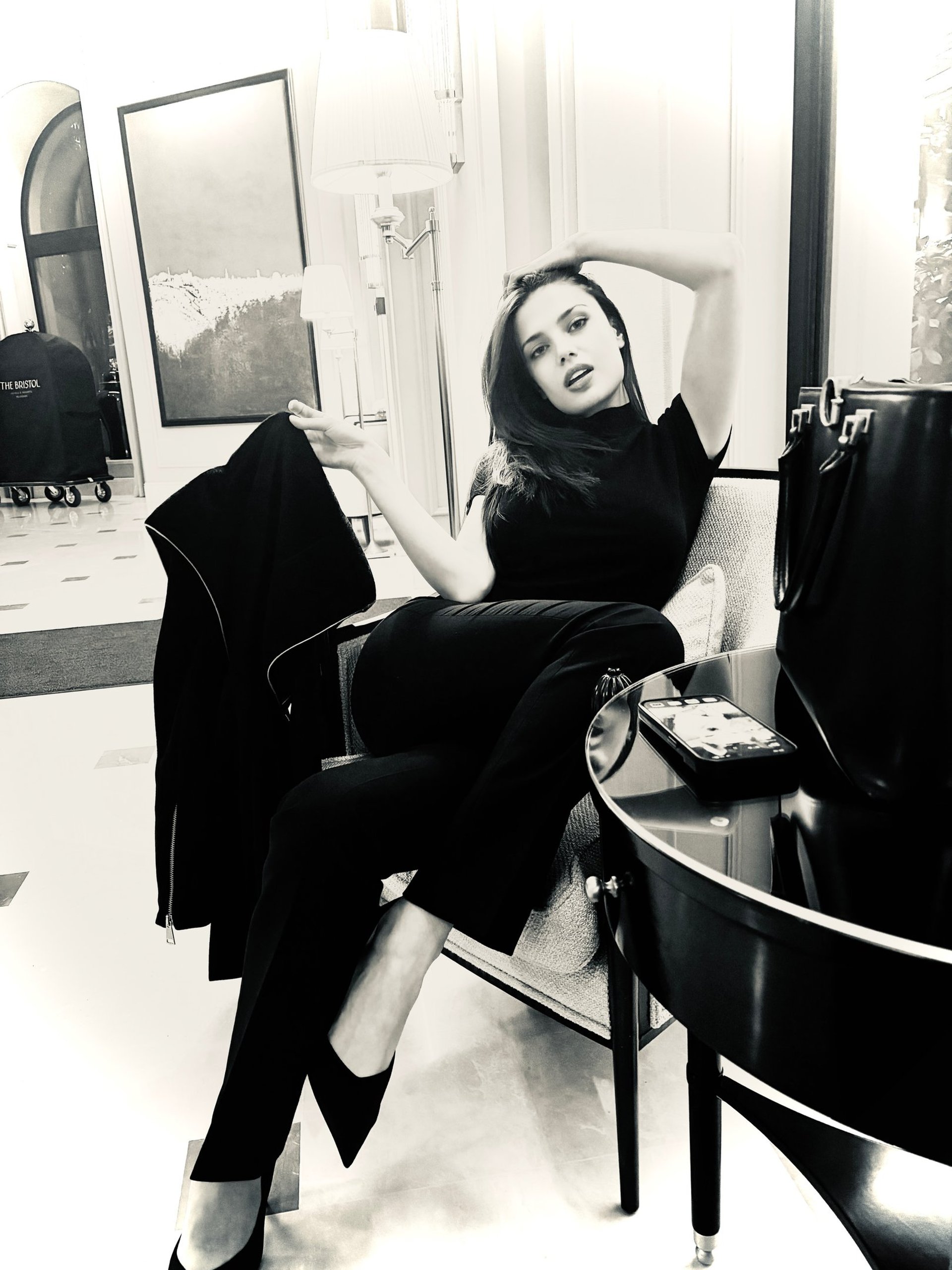 an abstract photo of a curved building with a blue sky in the background