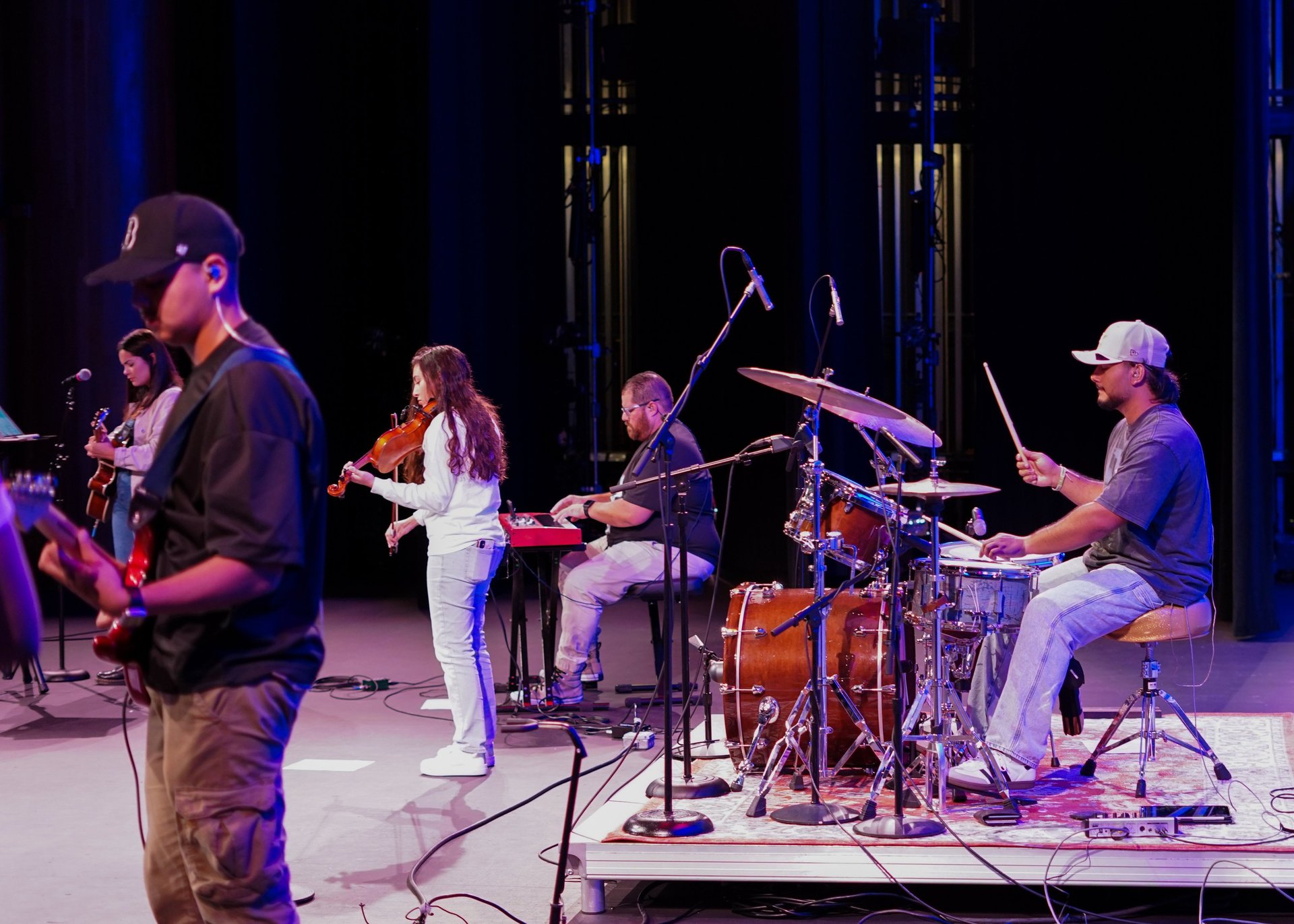 an abstract photo of a curved building with a blue sky in the background