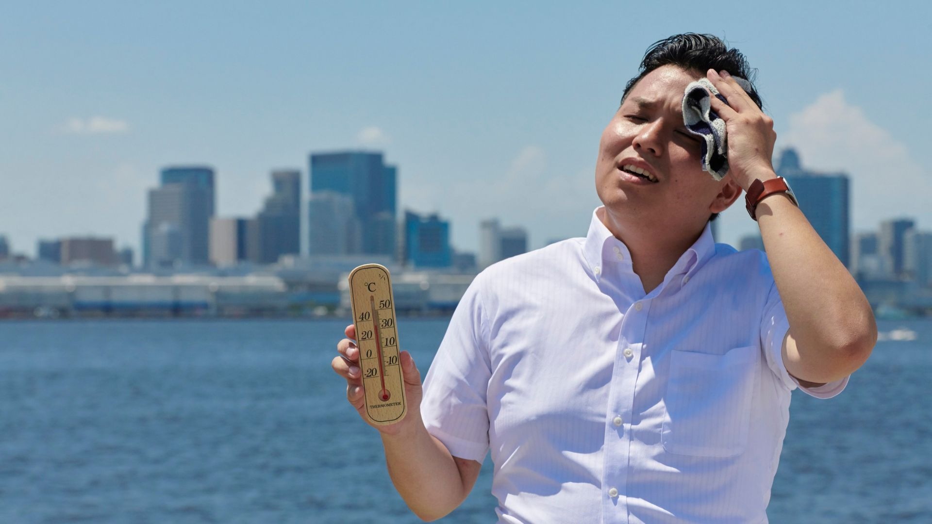 man suffering heat from summer