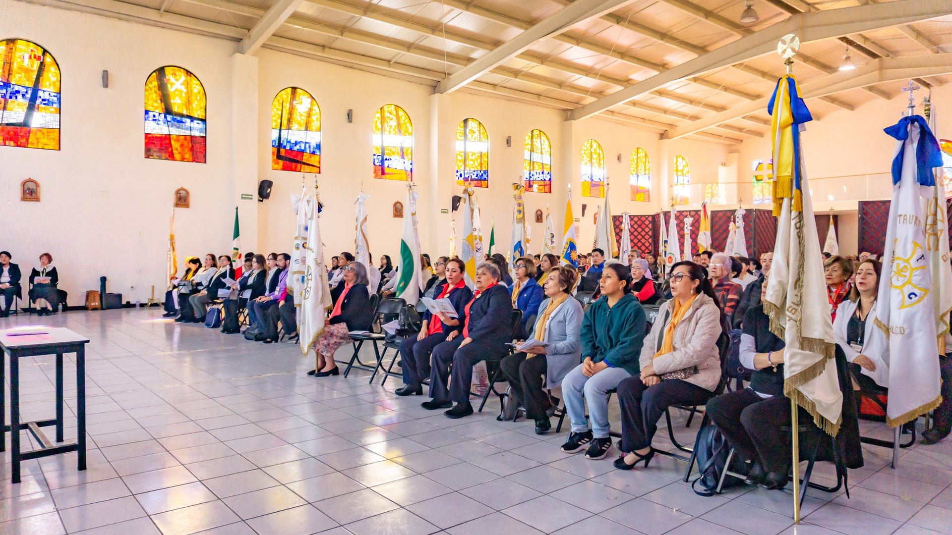an abstract photo of a curved building with a blue sky in the background