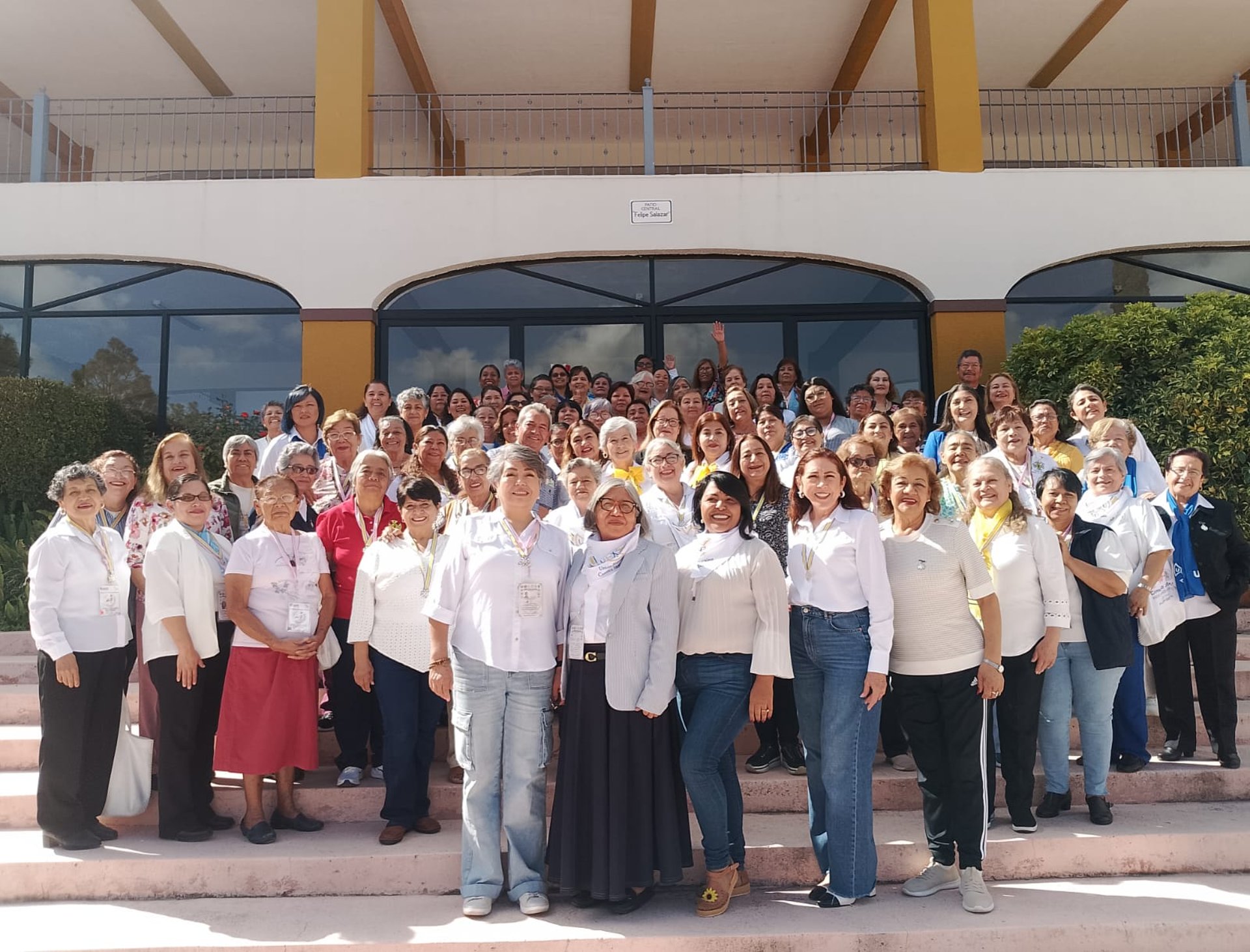 an abstract photo of a curved building with a blue sky in the background