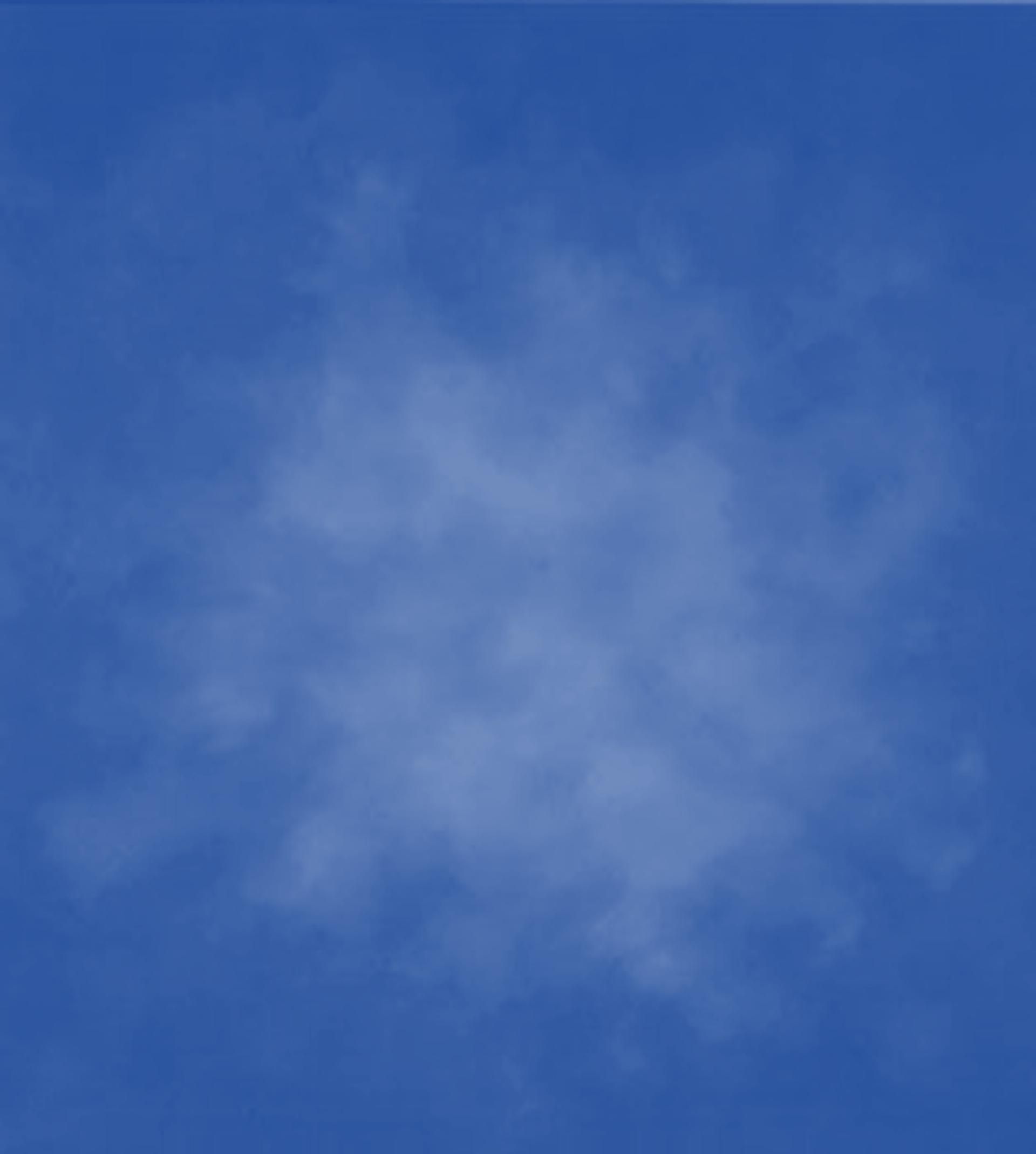 an abstract photo of a curved building with a blue sky in the background