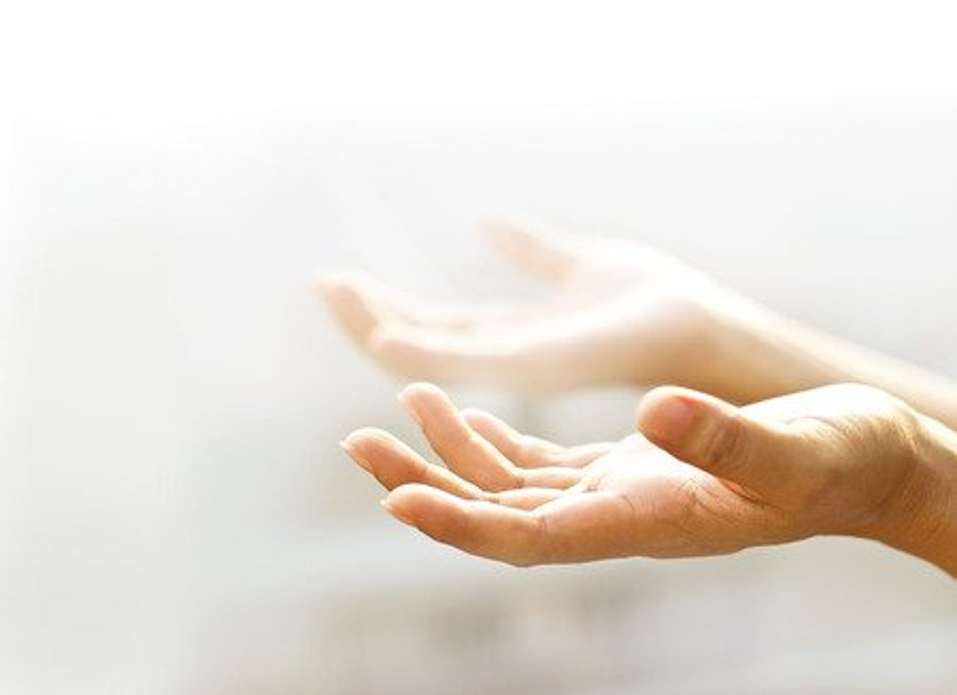 an abstract photo of a curved building with a blue sky in the background