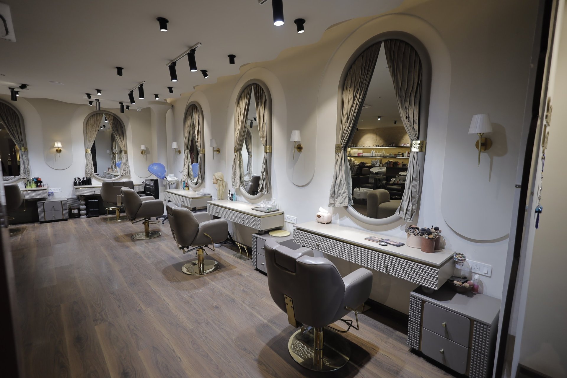 grayscale photo of woman holding hair blower