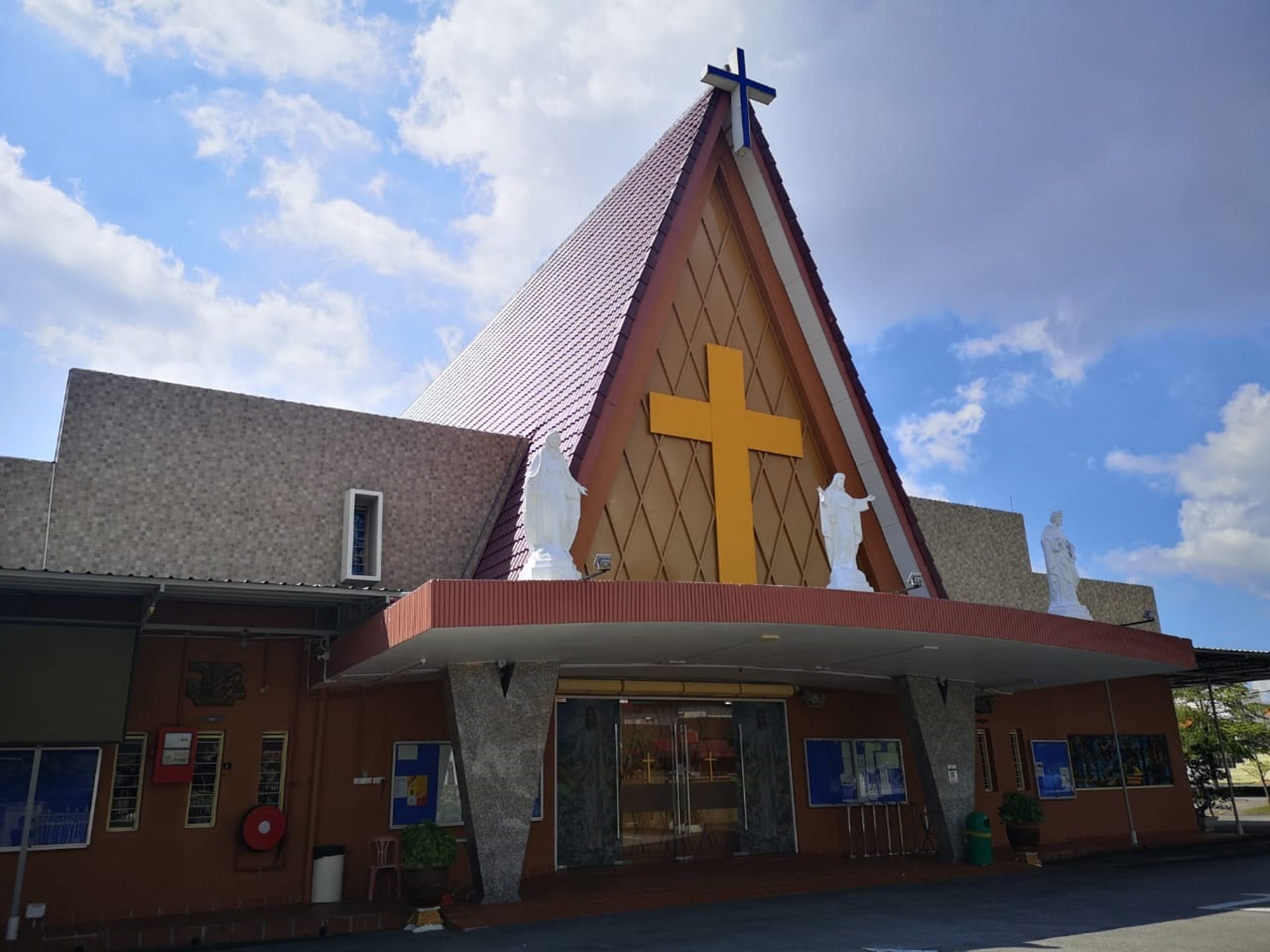 an abstract photo of a curved building with a blue sky in the background
