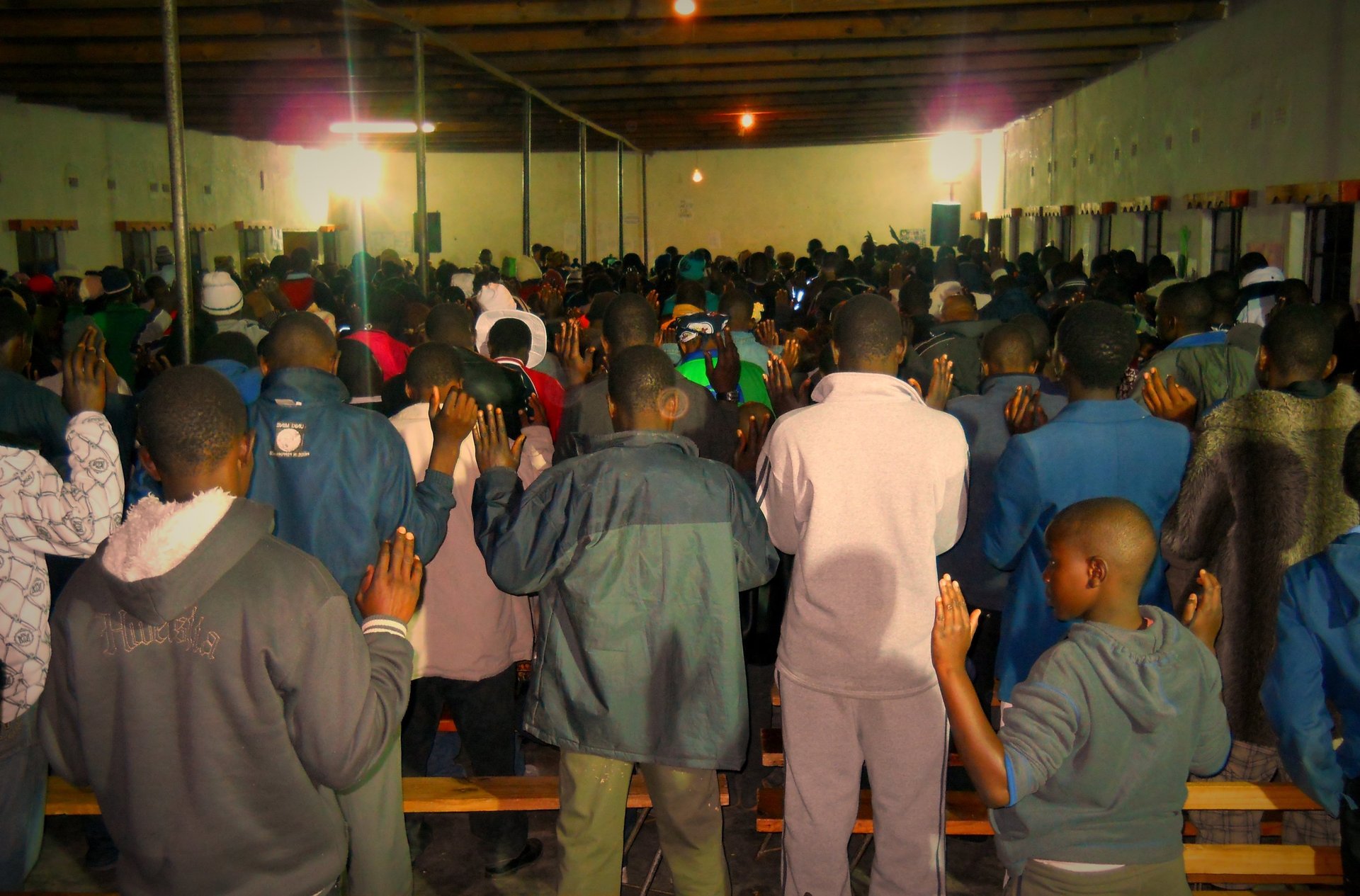 an abstract photo of a curved building with a blue sky in the background