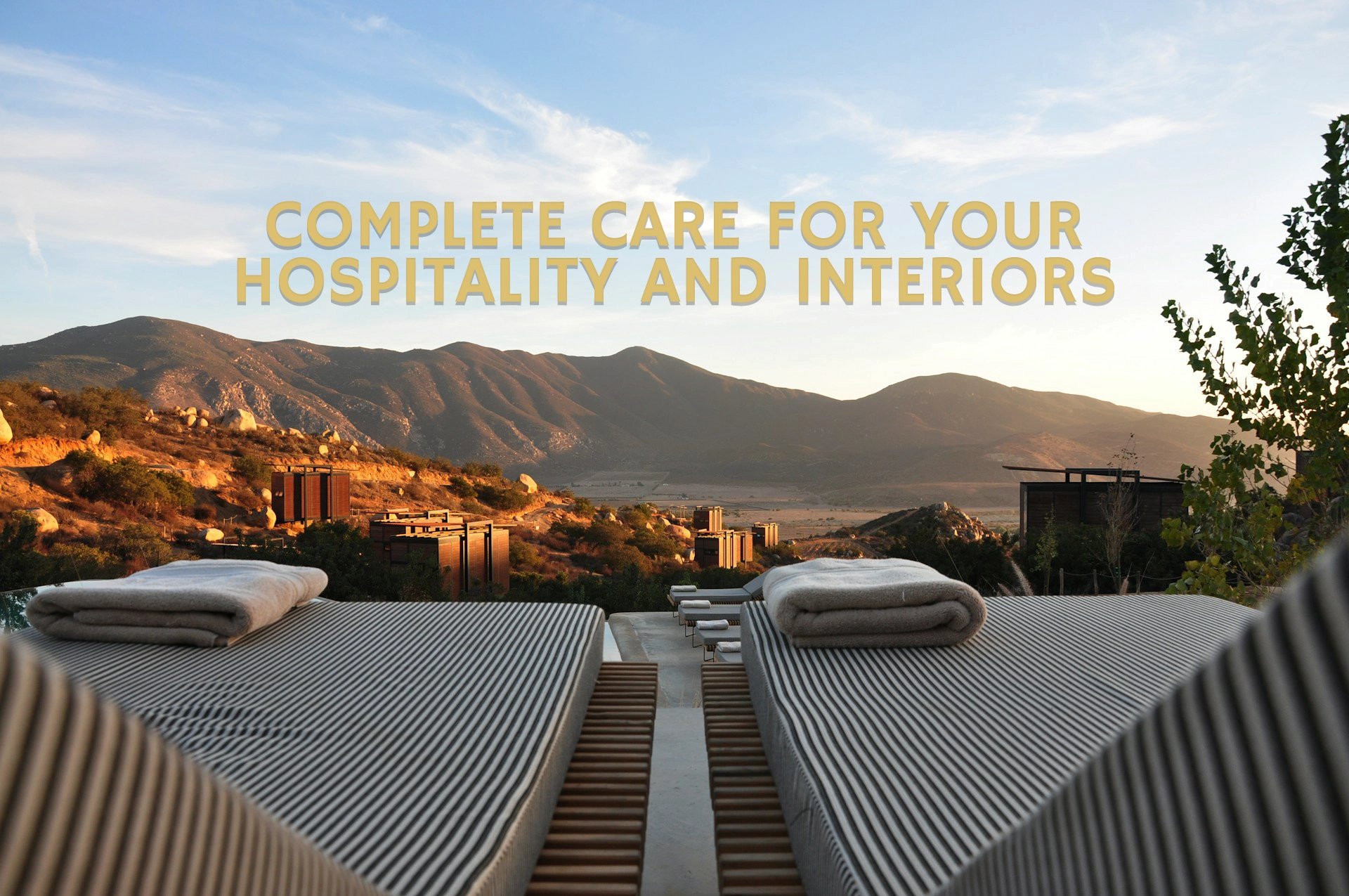 sunloungers fronting buildings near mountain