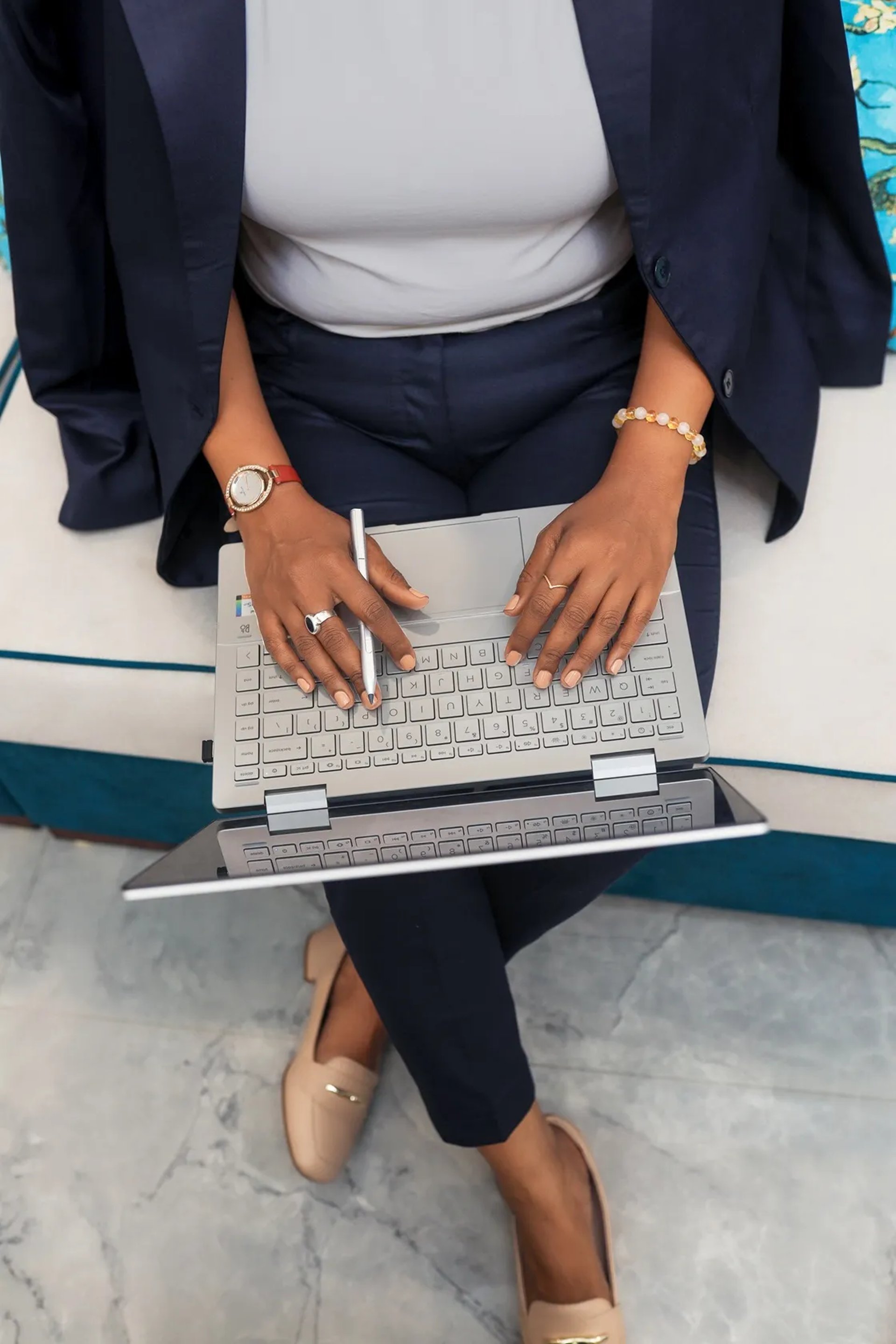 a white desk with a laptop on top of it