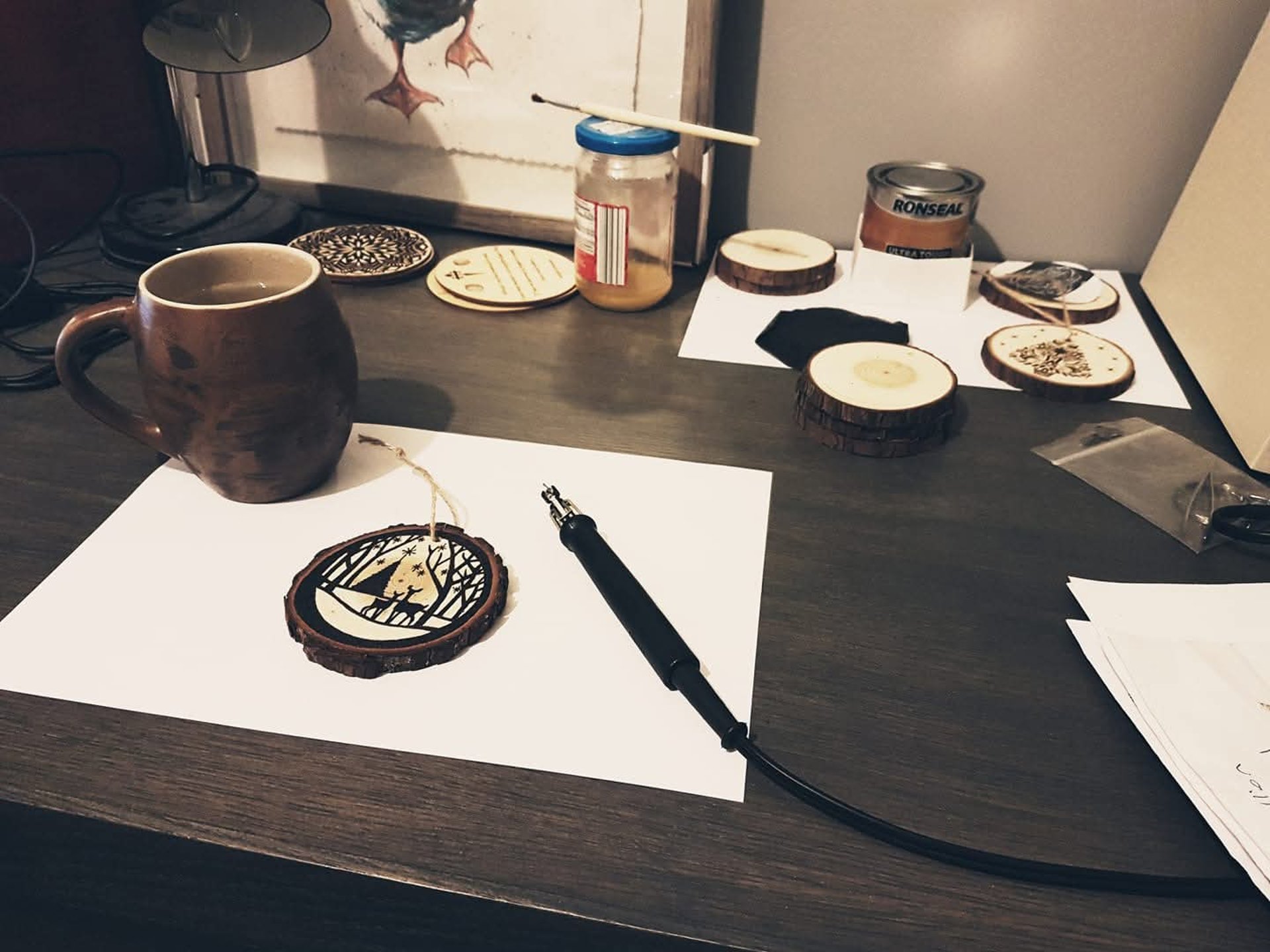 person holding red and black hand tool