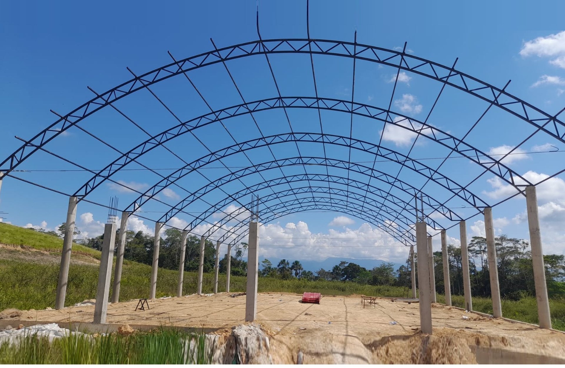 yellow and black excavator on rocky ground