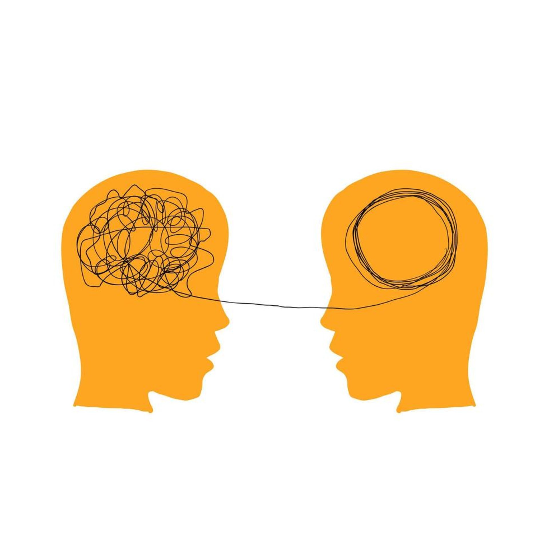 man in brown jacket sitting on concrete fence during daytime