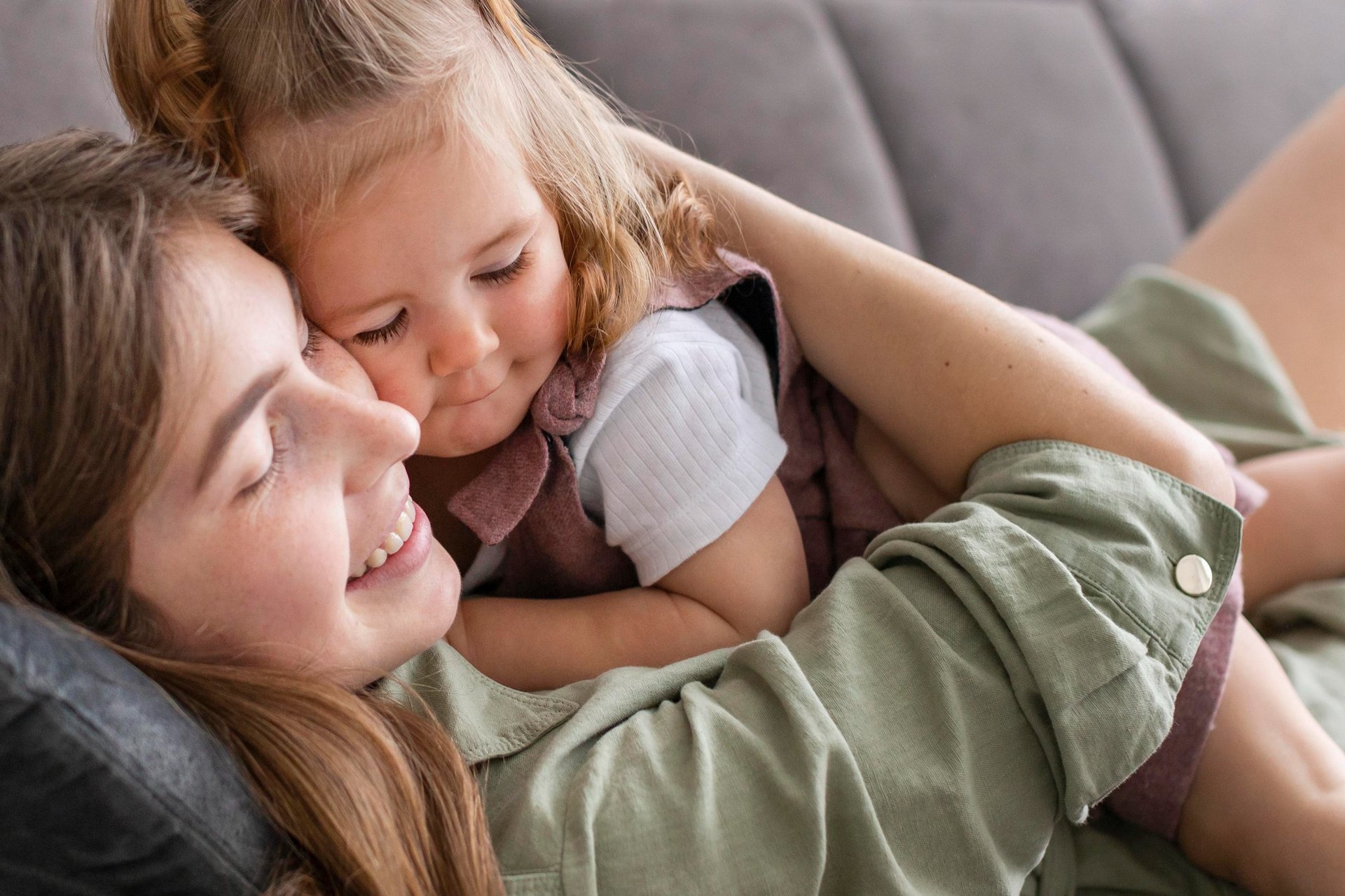 A mother and daughter playing in a field