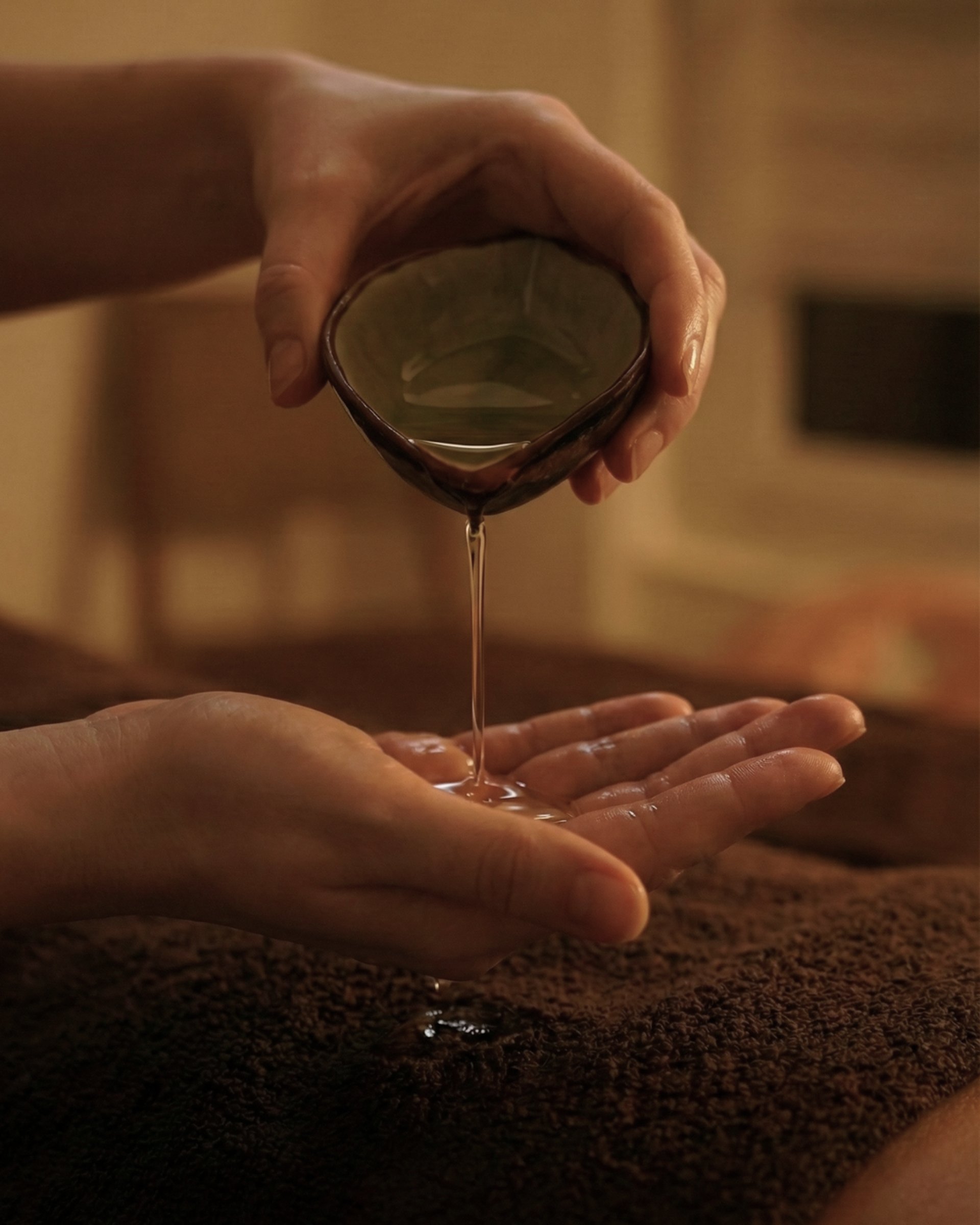 a woman laying on a bed with her hands together