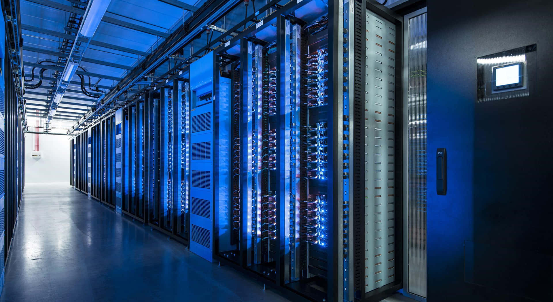 an abstract photo of a curved building with a blue sky in the background
