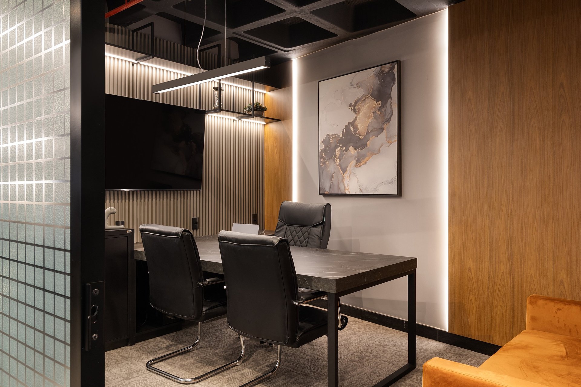 an abstract photo of a curved building with a blue sky in the background