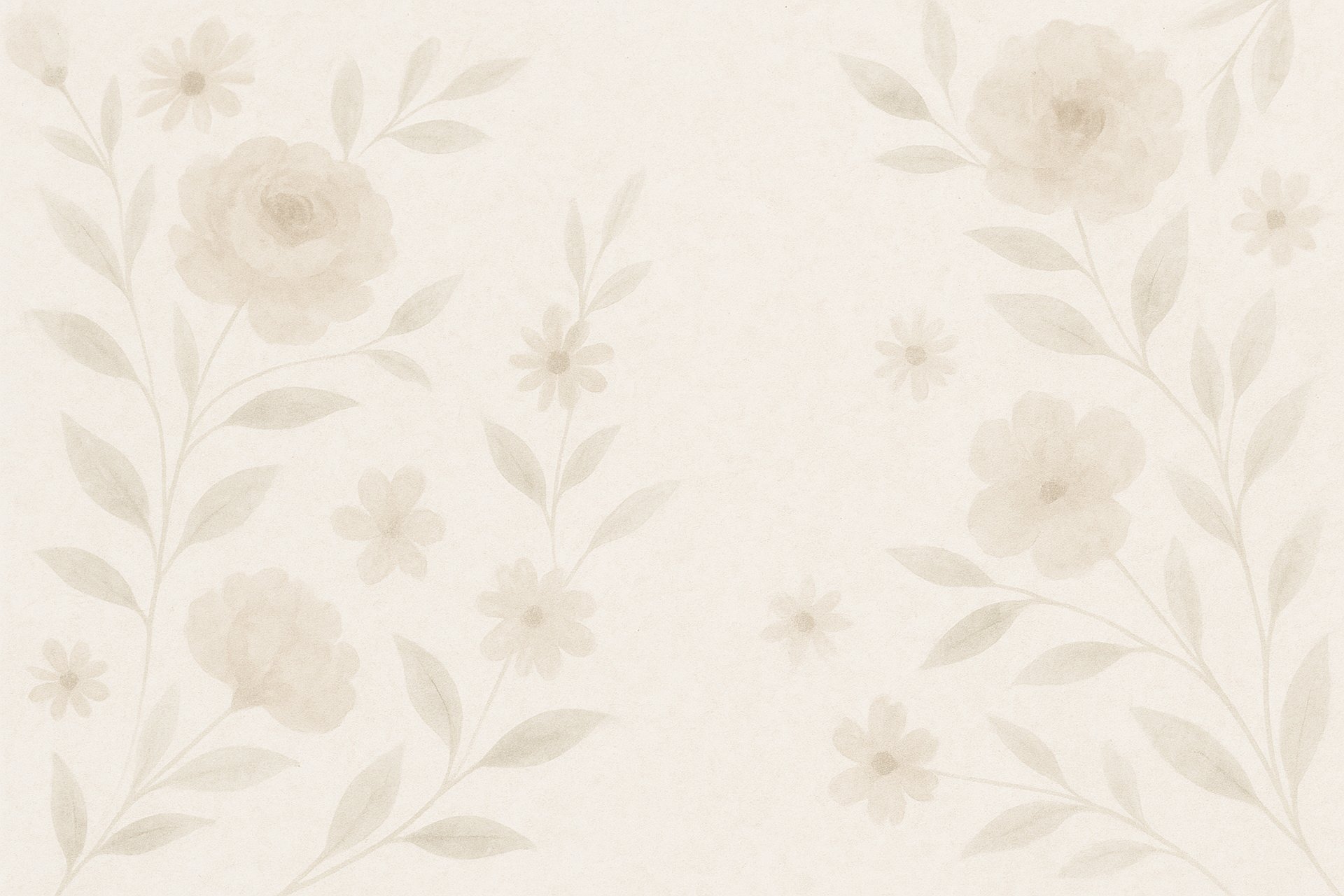 Flowers in a pot sit on a neutral surface.