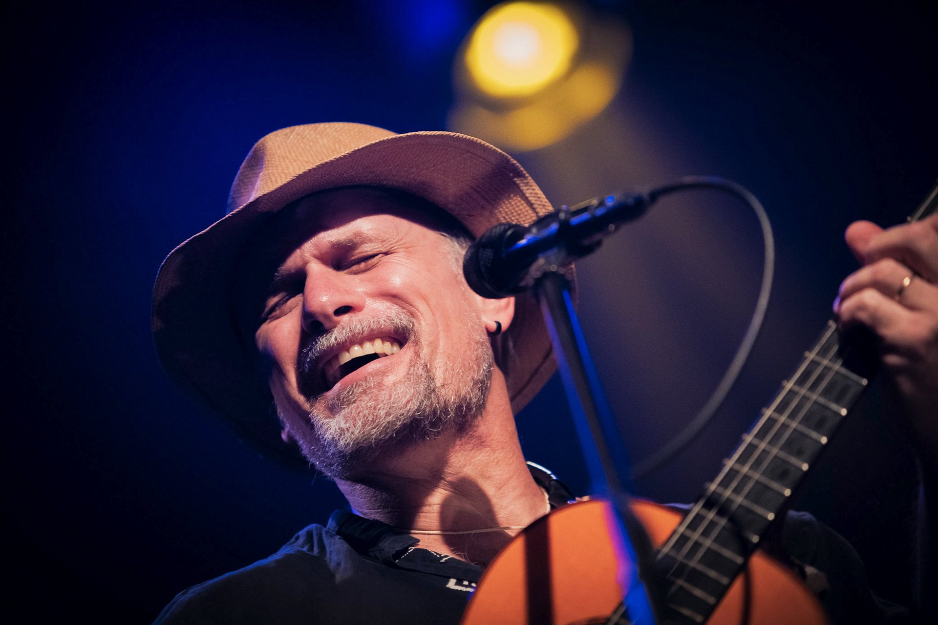 woman wearing yellow long-sleeved dress under white clouds and blue sky during daytime