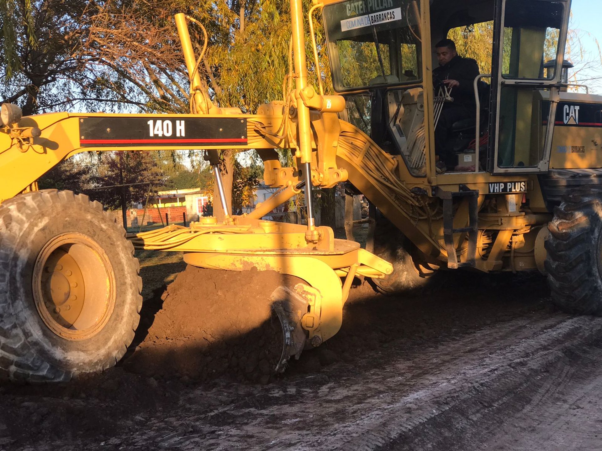 brown metal machine on brown soil during daytime