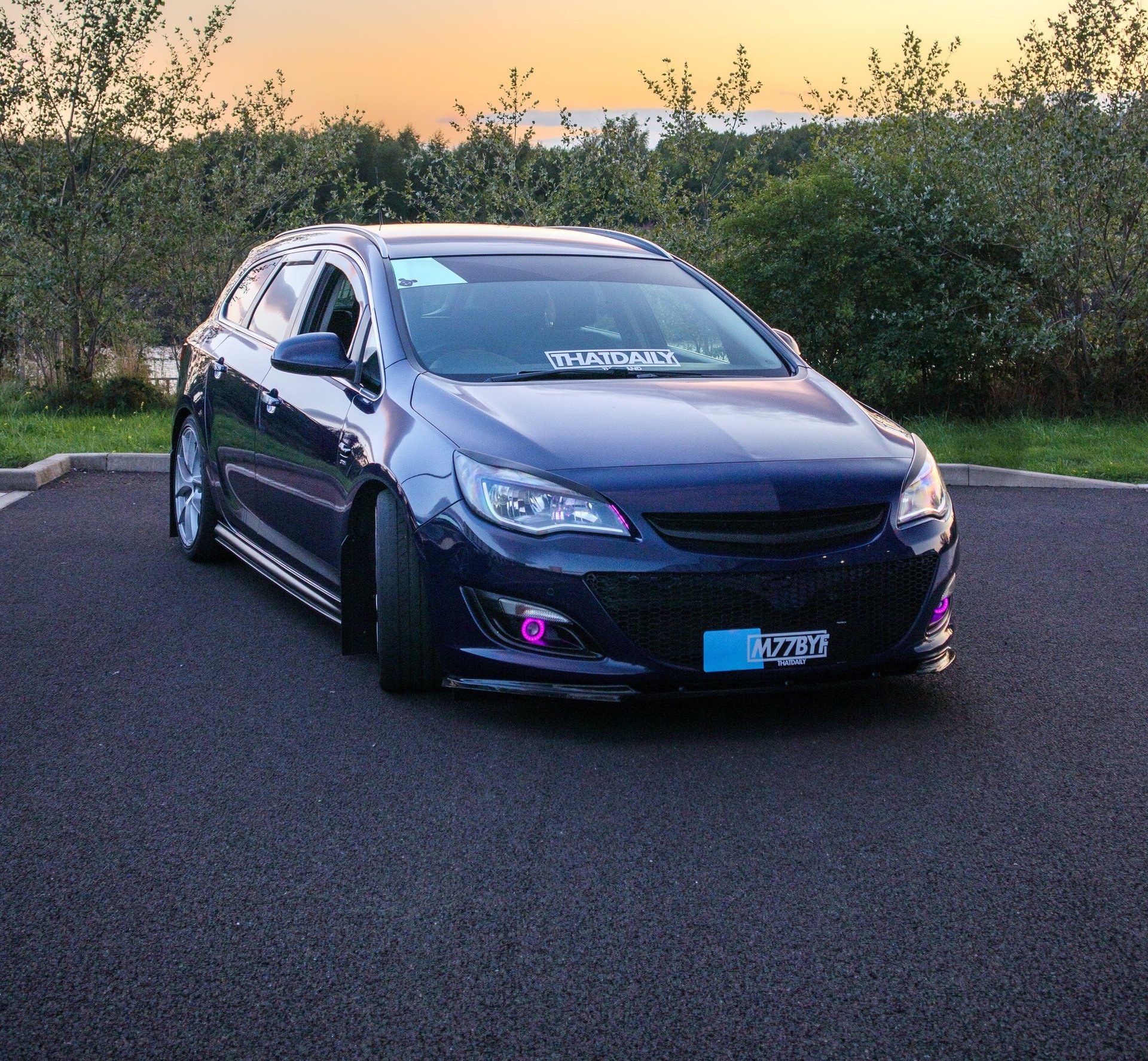 person running on road street cliff during golden hour