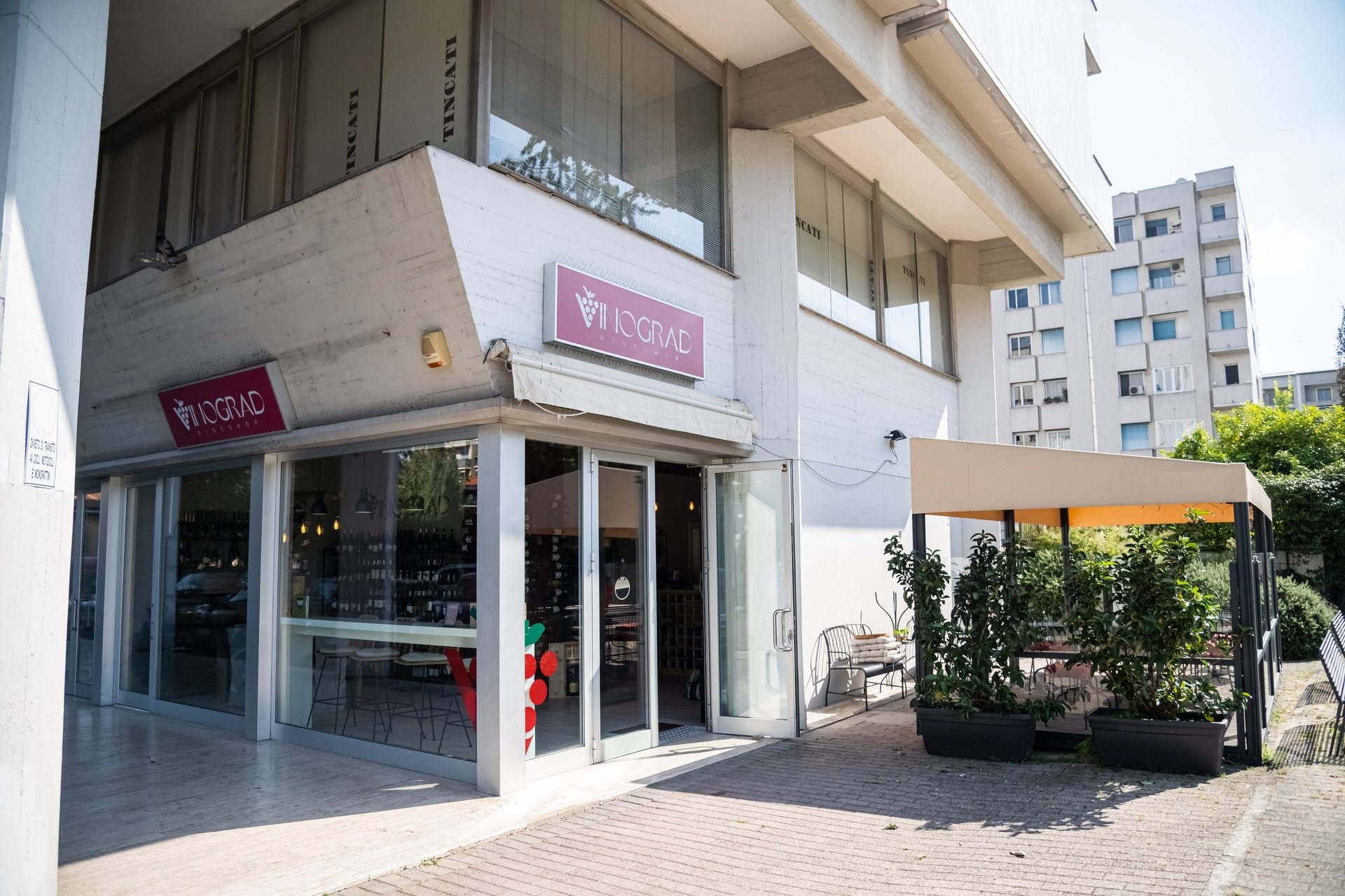 an abstract photo of a curved building with a blue sky in the background