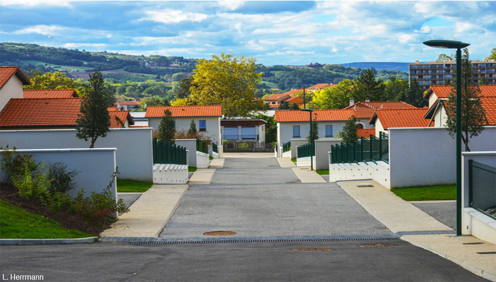 woman wearing yellow long-sleeved dress under white clouds and blue sky during daytime