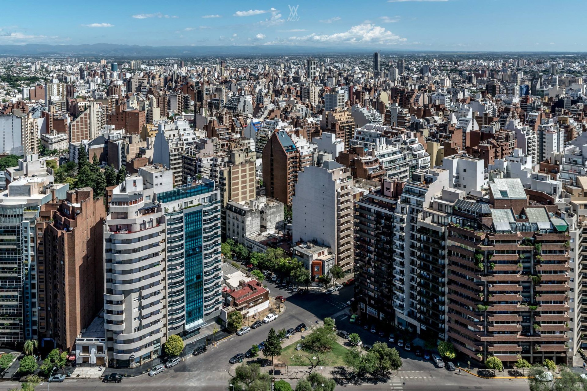 an abstract photo of a curved building with a blue sky in the background