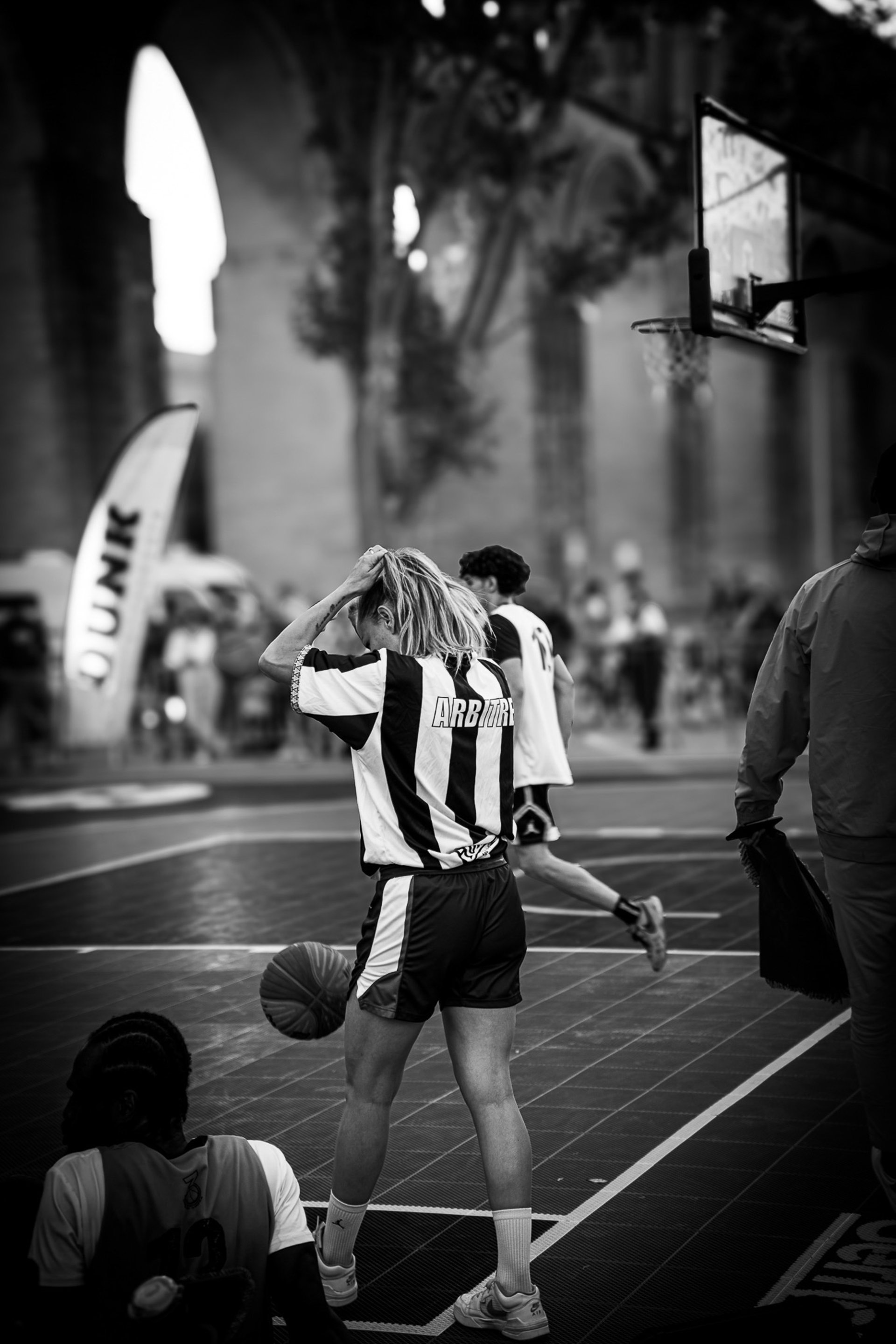 people looking on man standing on stage