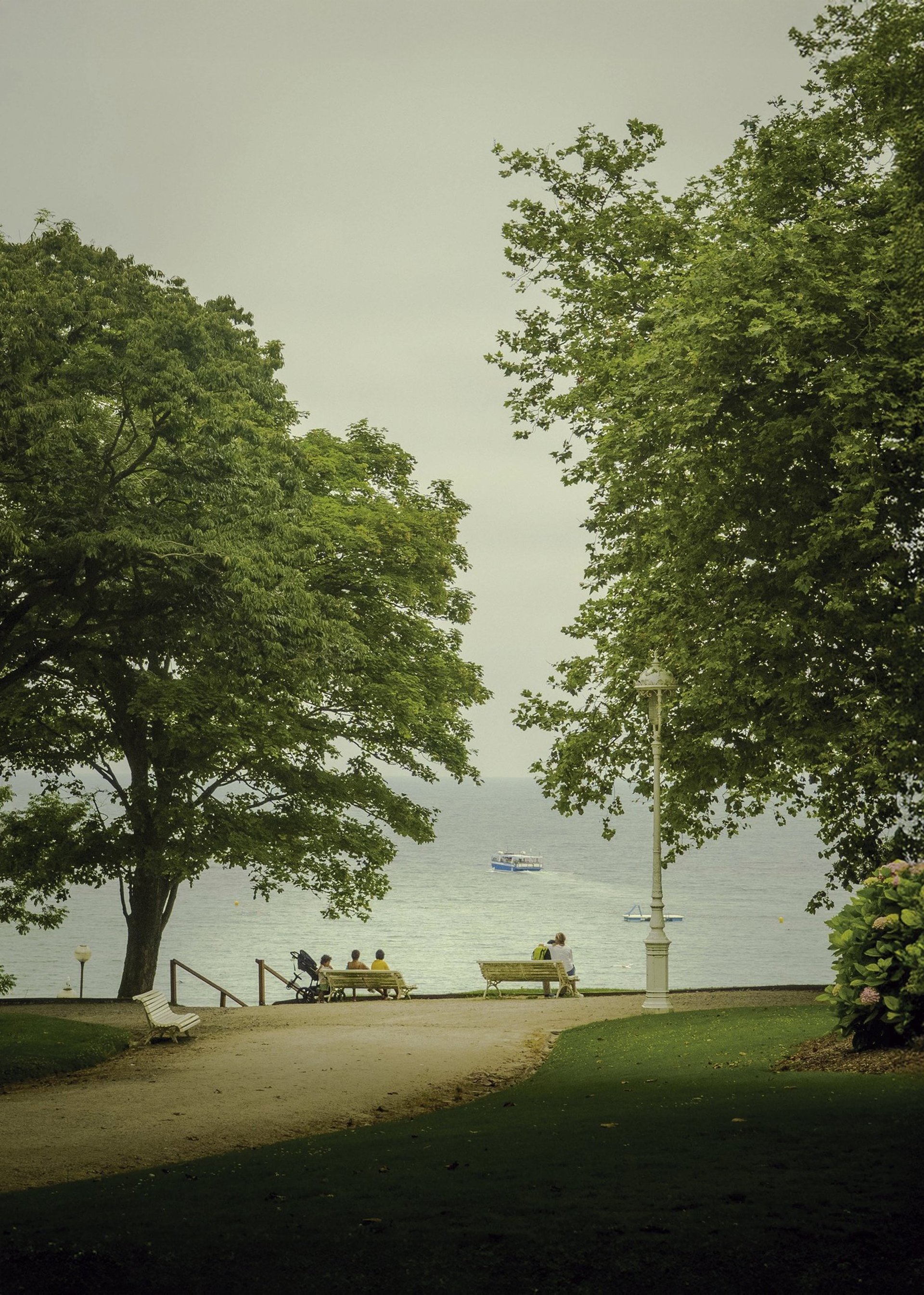 an abstract photo of a curved building with a blue sky in the background