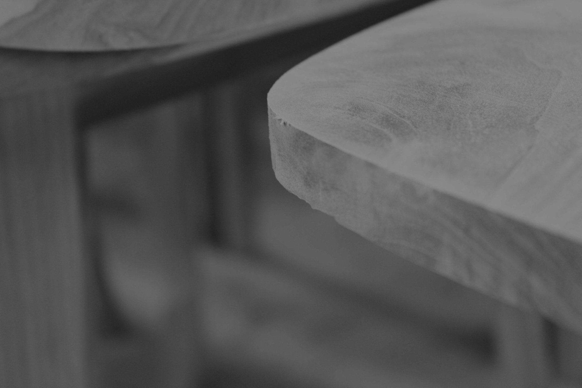person using chisel while curving wood