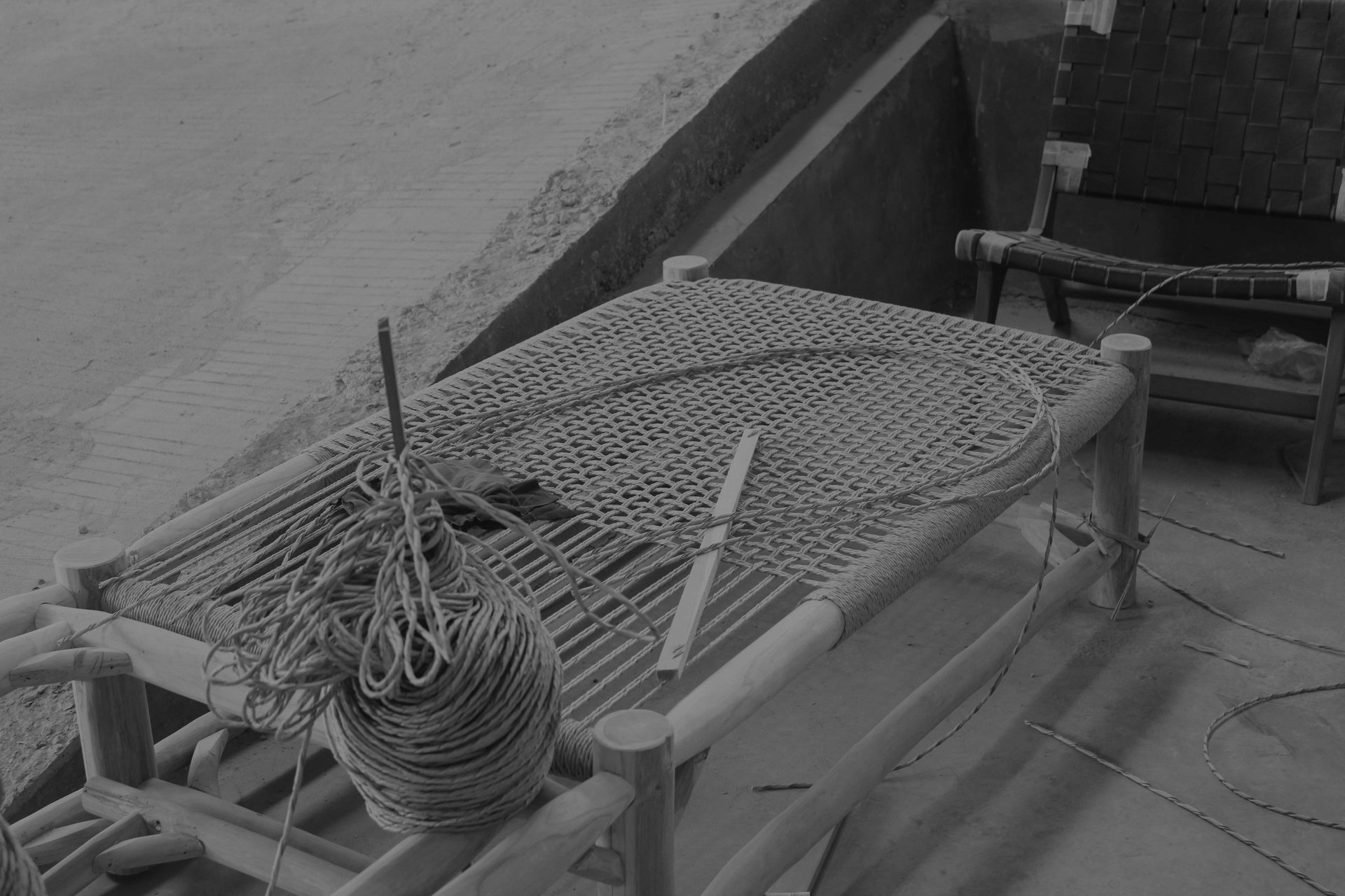 person using chisel while curving wood