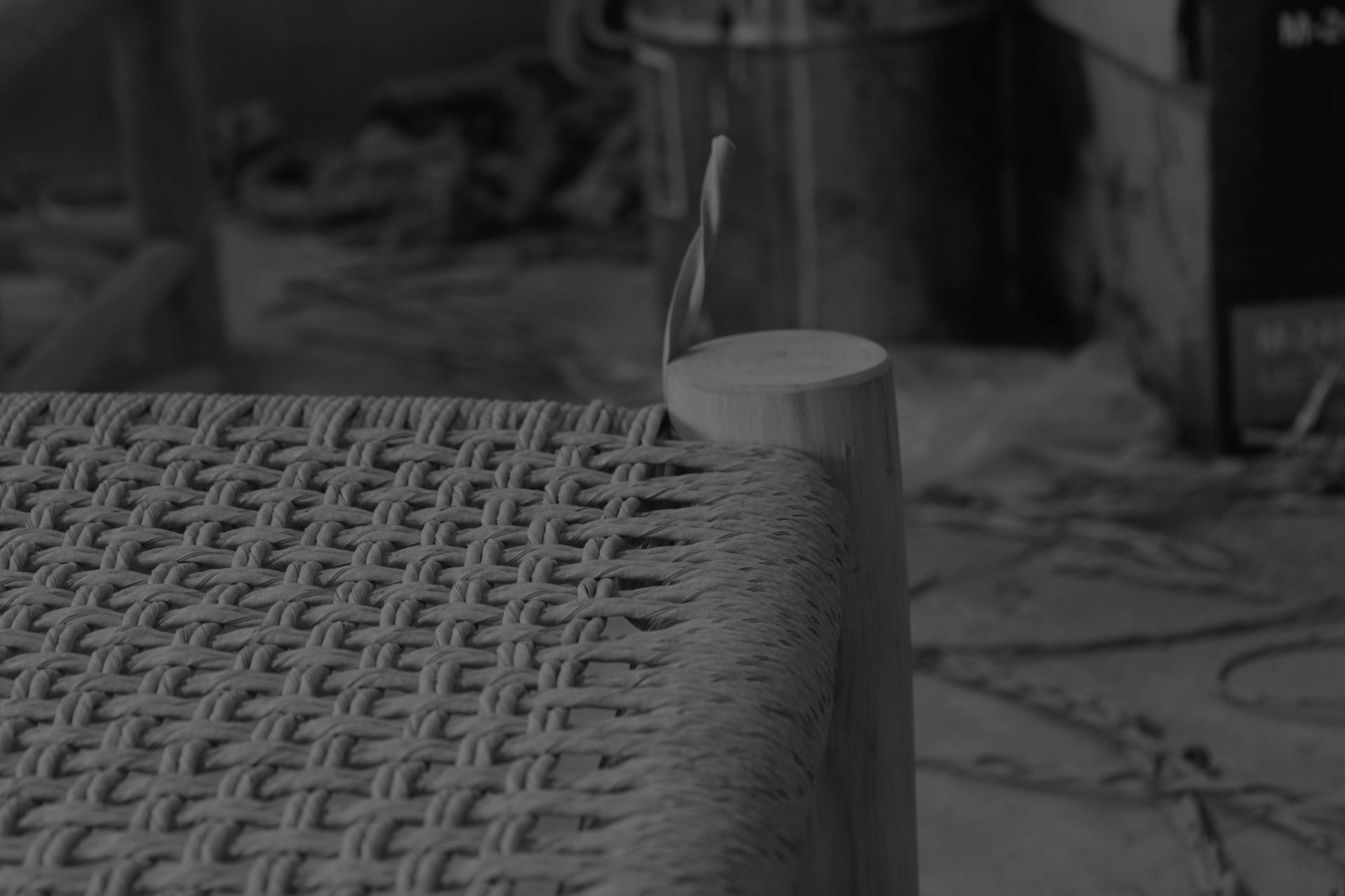 person using chisel while curving wood
