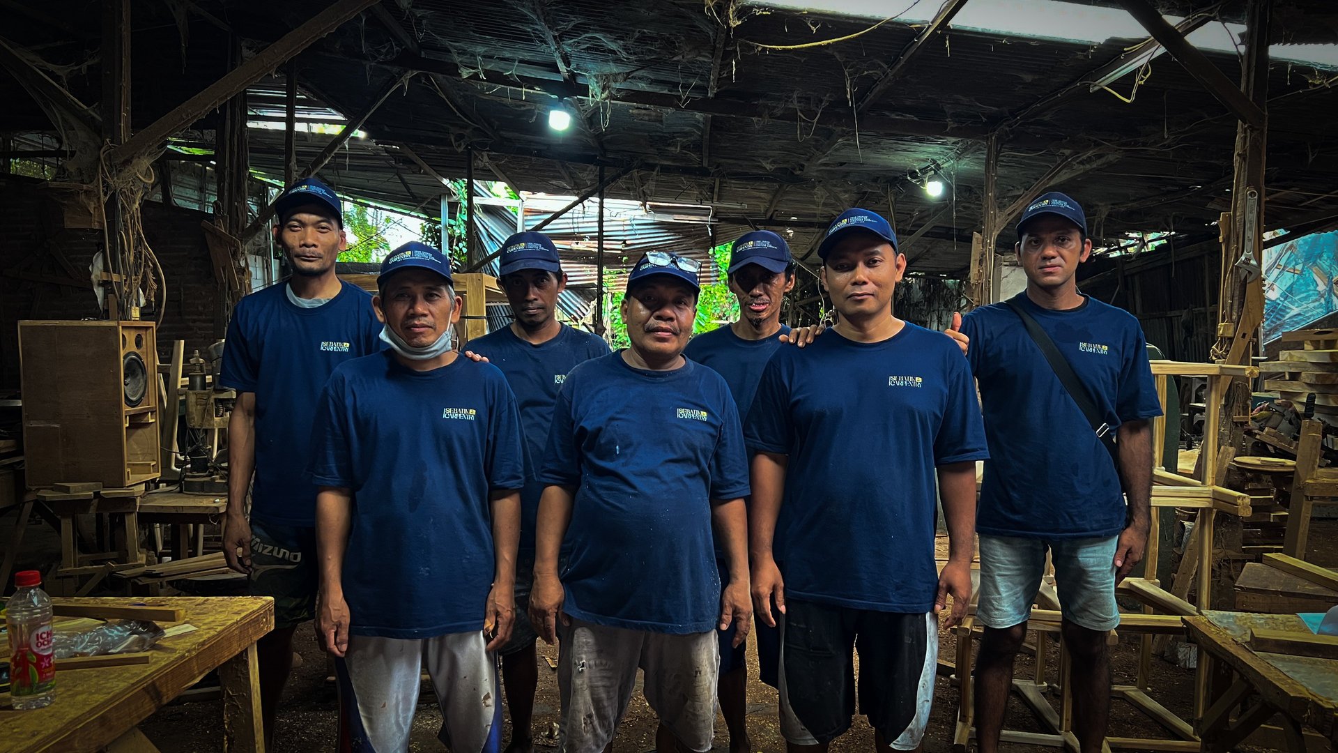 person using chisel while curving wood