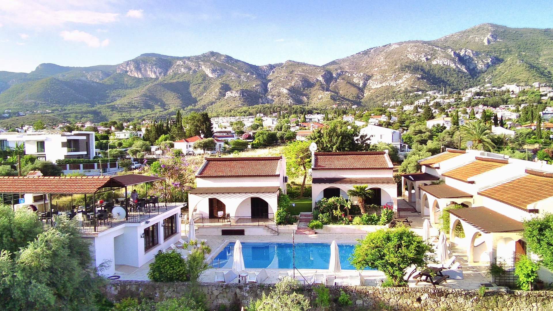 an abstract photo of a curved building with a blue sky in the background