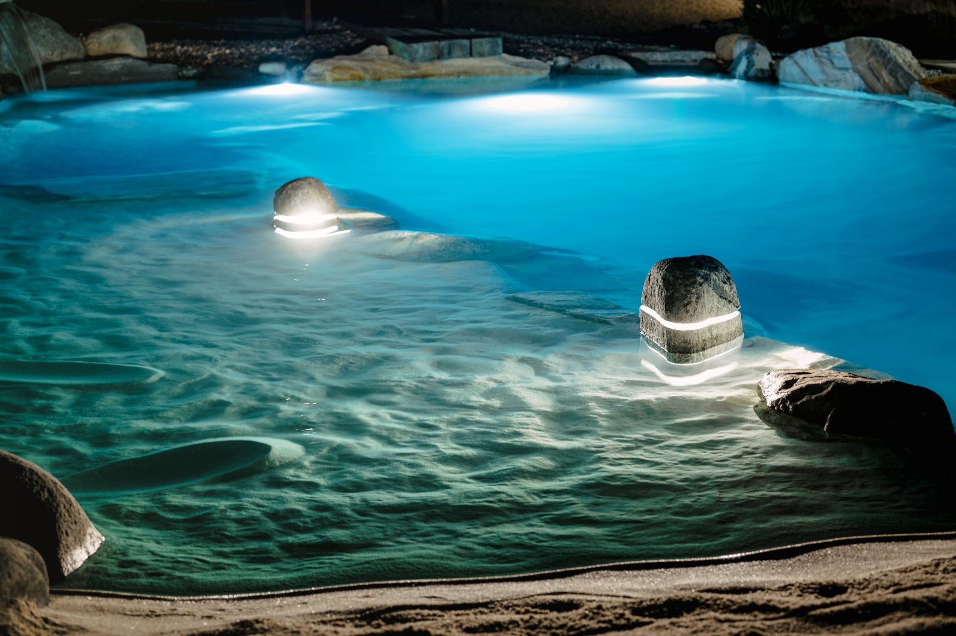 a patio with a couch and a table and chairs