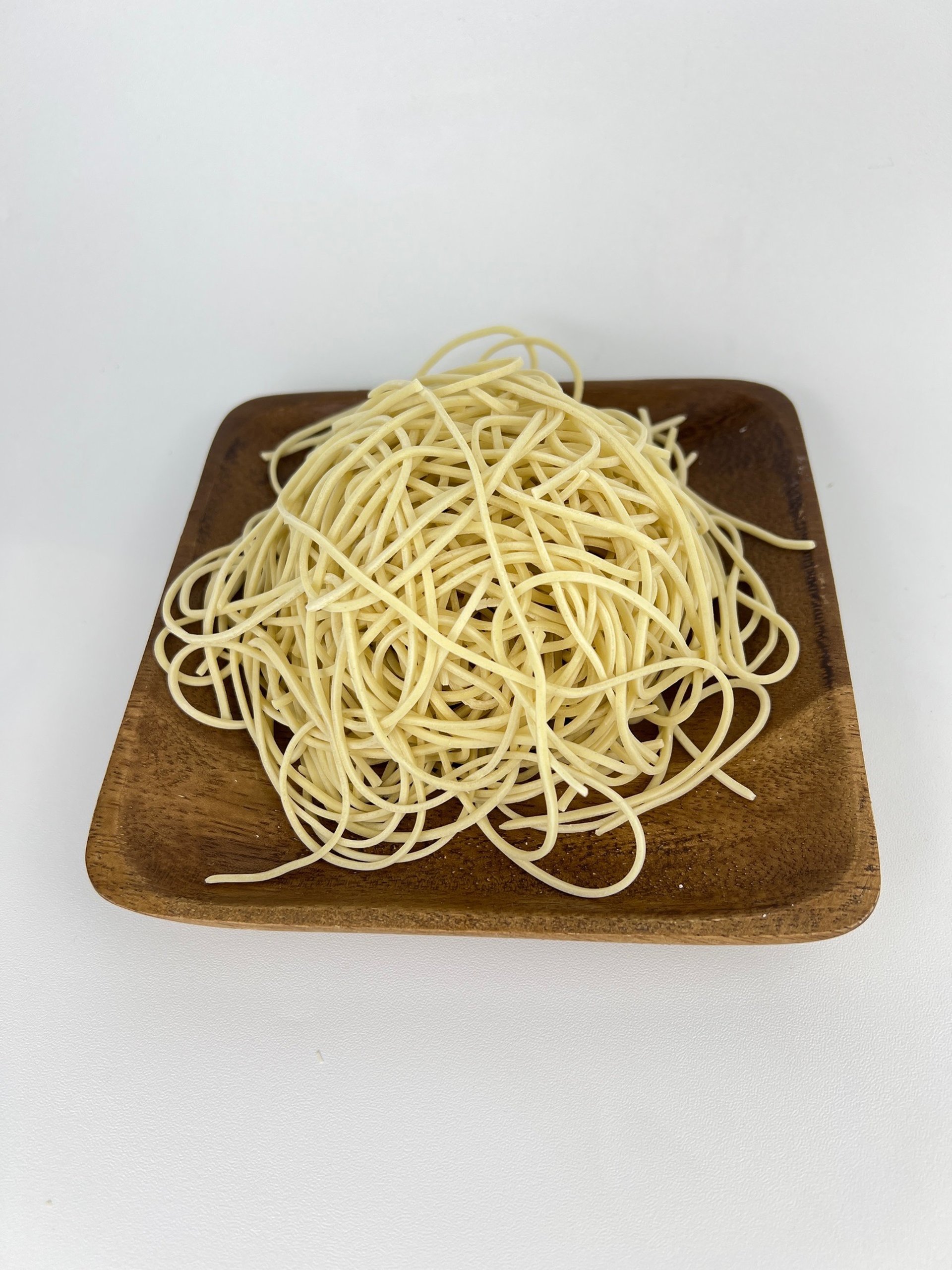 an abstract photo of a curved building with a blue sky in the background