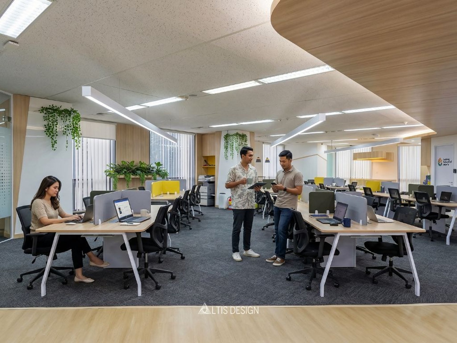 a large open office space with many desks and chairs