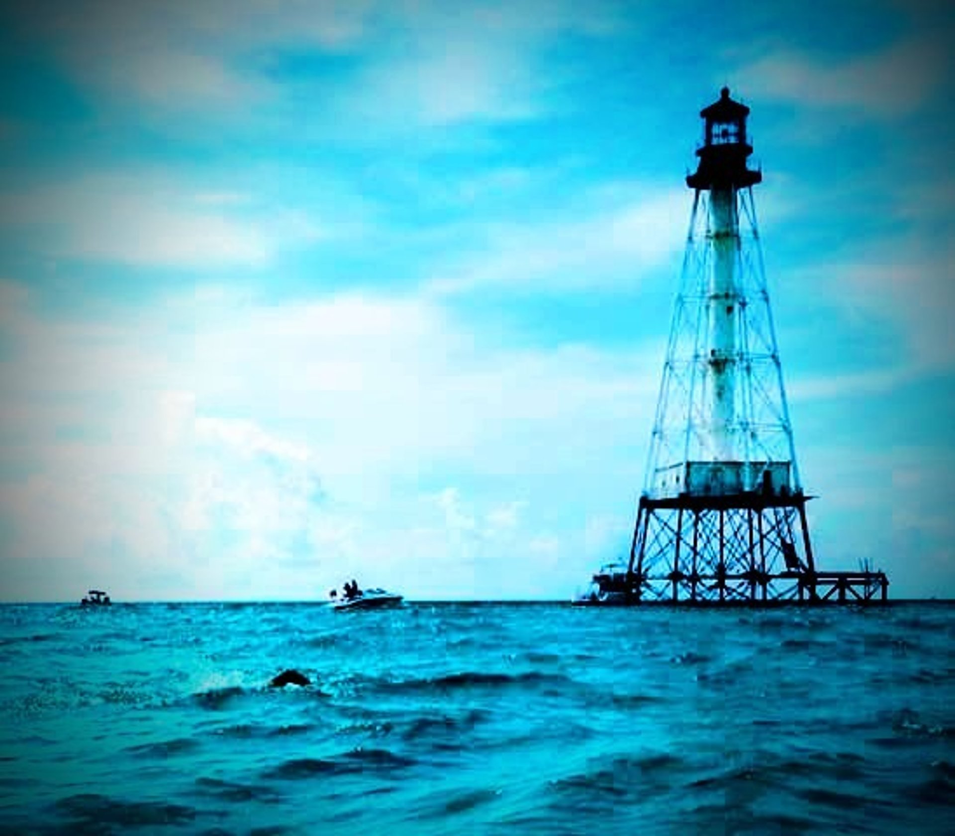 body of water under blue sky during sunset