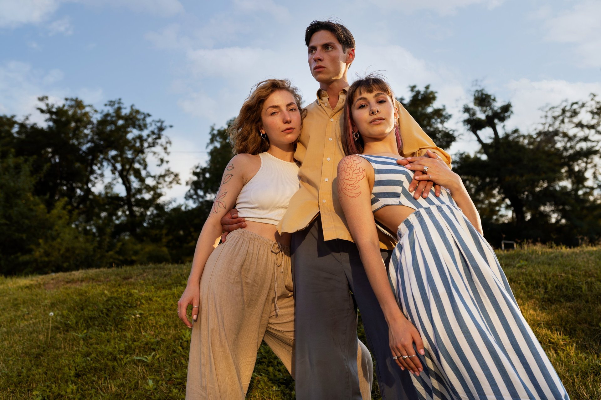 woman wearing yellow long-sleeved dress under white clouds and blue sky during daytime