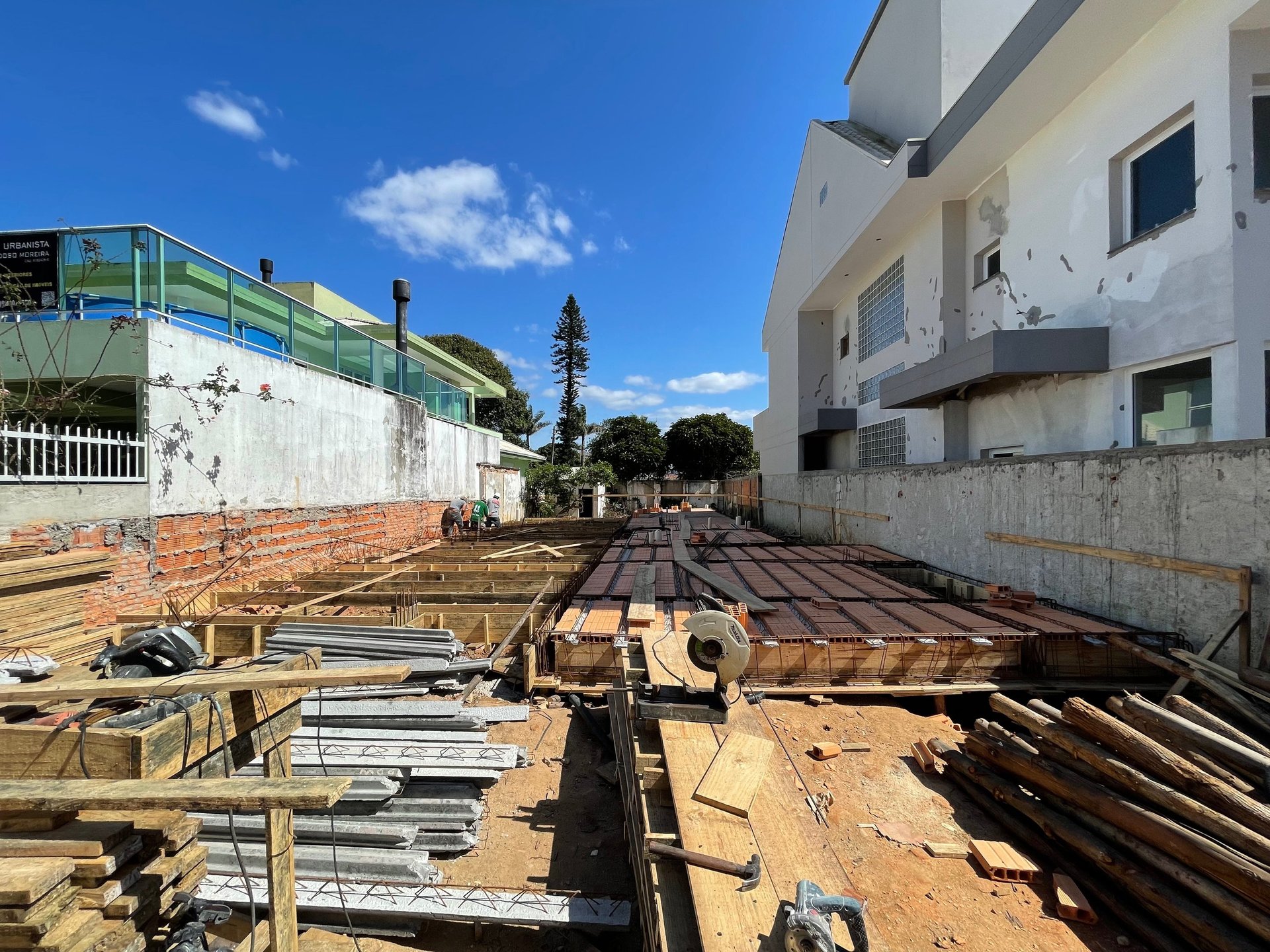 woman wearing yellow long-sleeved dress under white clouds and blue sky during daytime