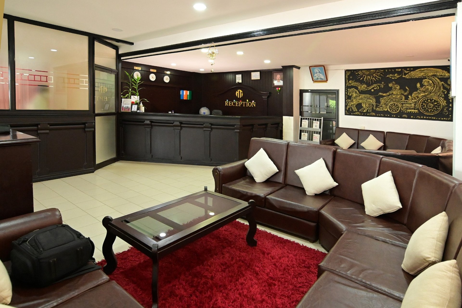 black and white bed near brown wooden table
