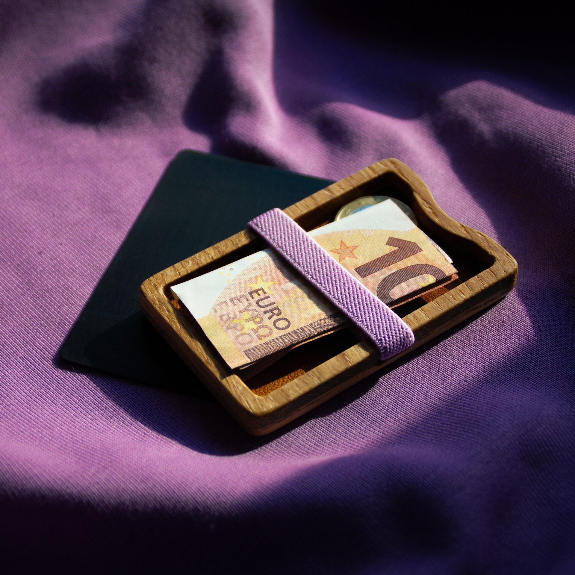 an abstract photo of a curved building with a blue sky in the background