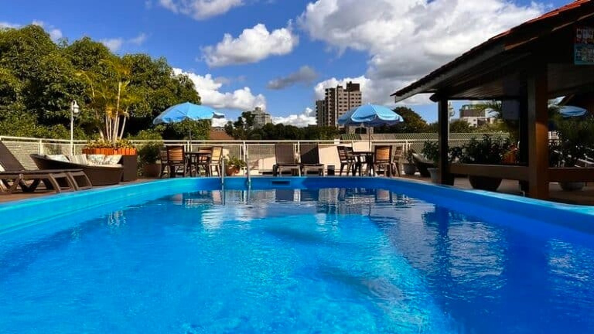 woman wearing yellow long-sleeved dress under white clouds and blue sky during daytime