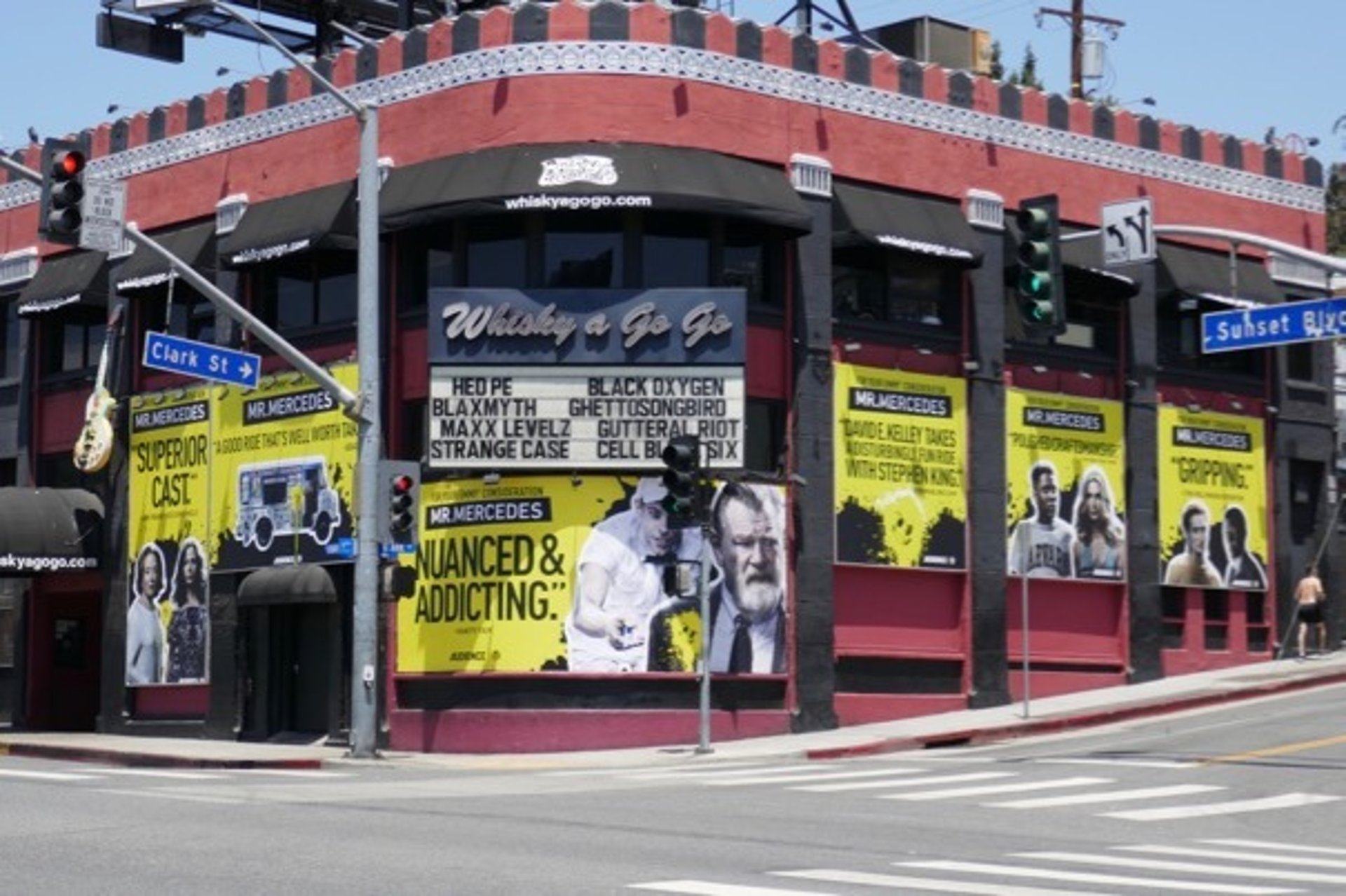 woman wearing yellow long-sleeved dress under white clouds and blue sky during daytime