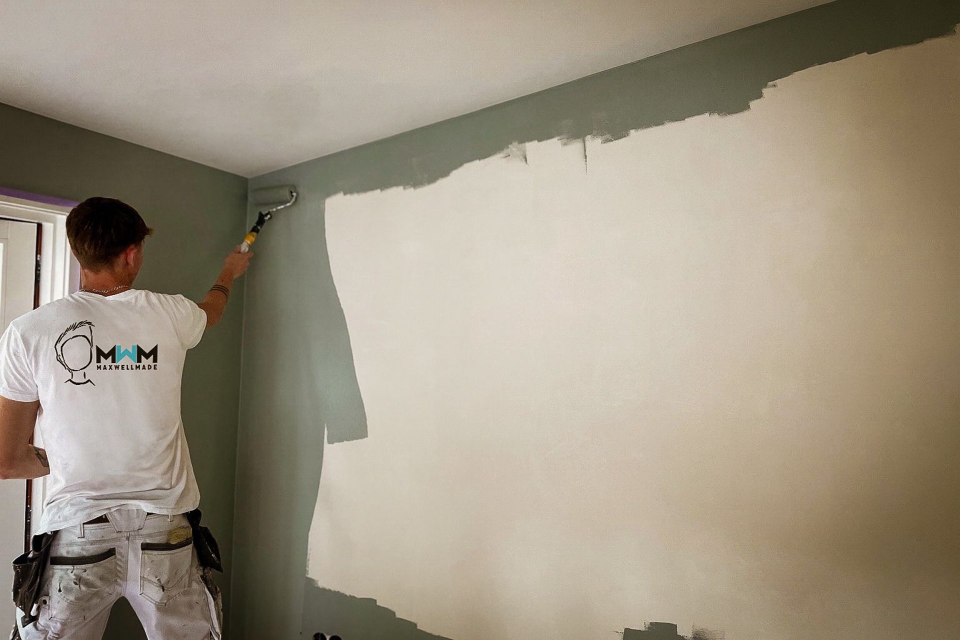 A car parked in front of a building under scaffolding