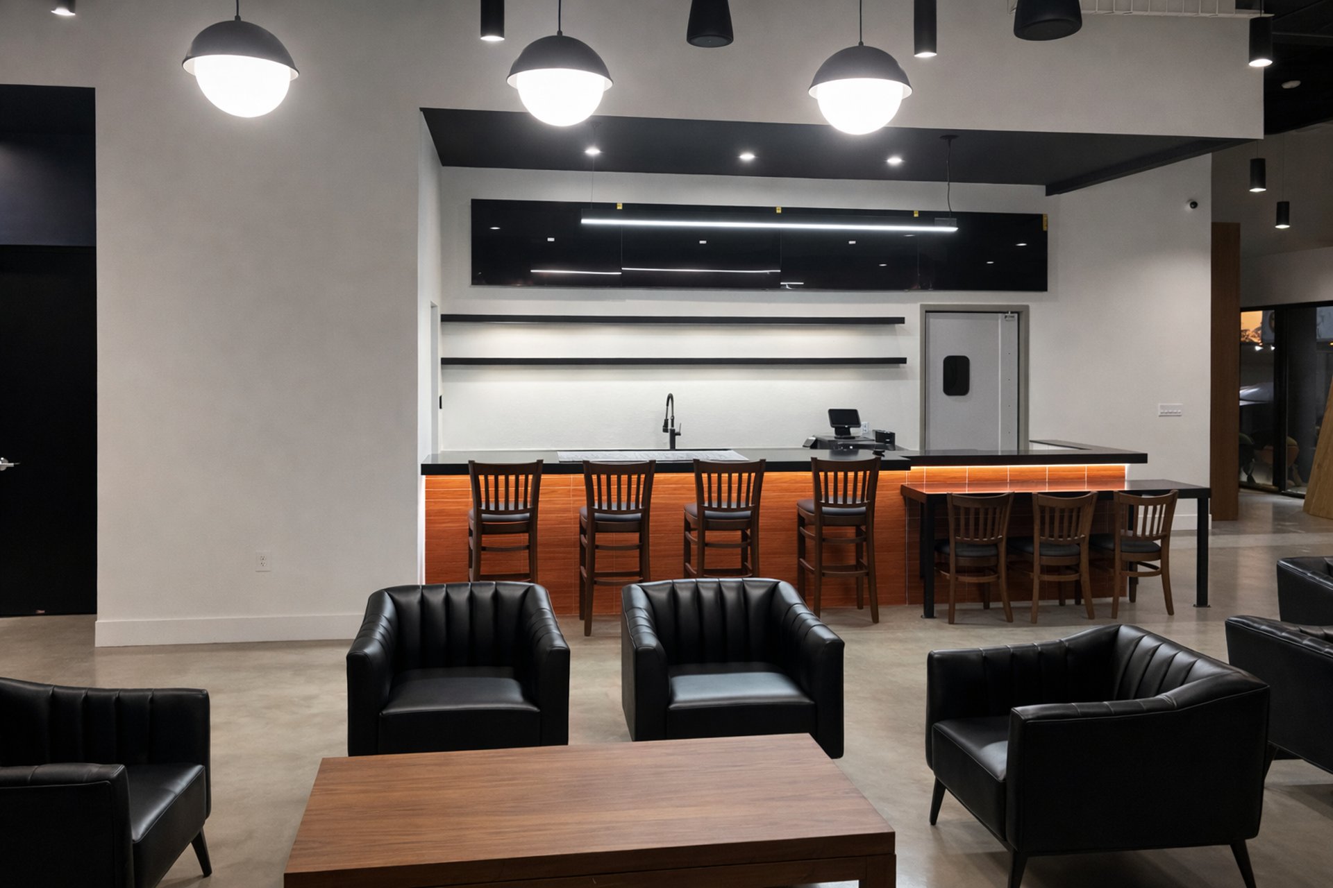 an abstract photo of a curved building with a blue sky in the background