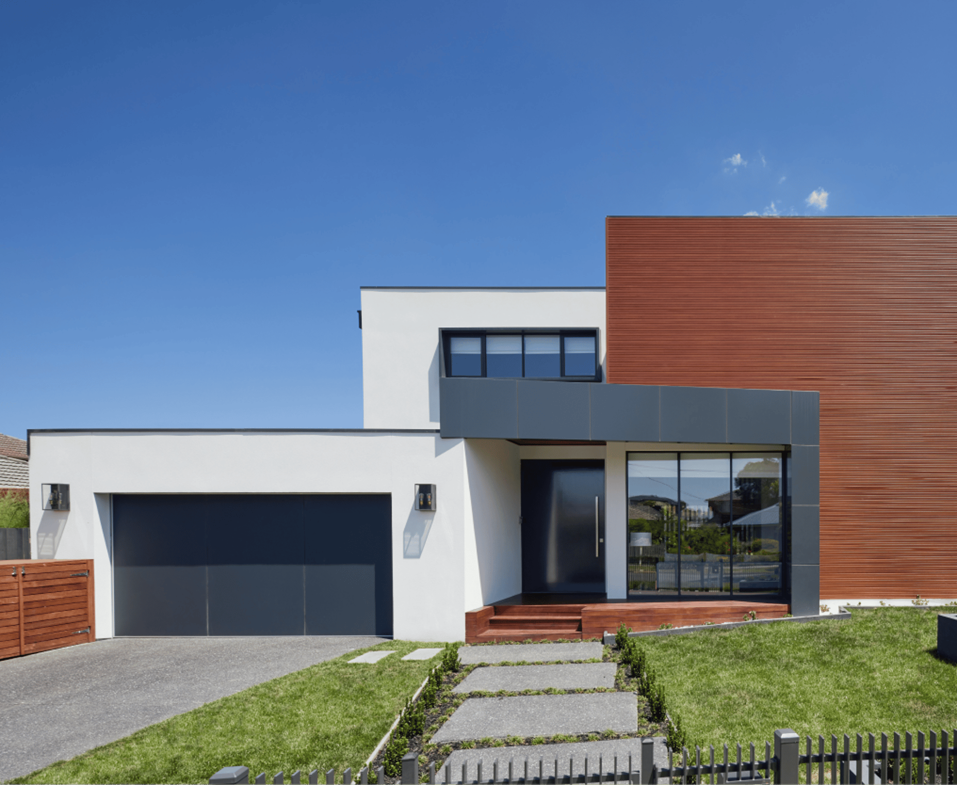 an abstract photo of a curved building with a blue sky in the background