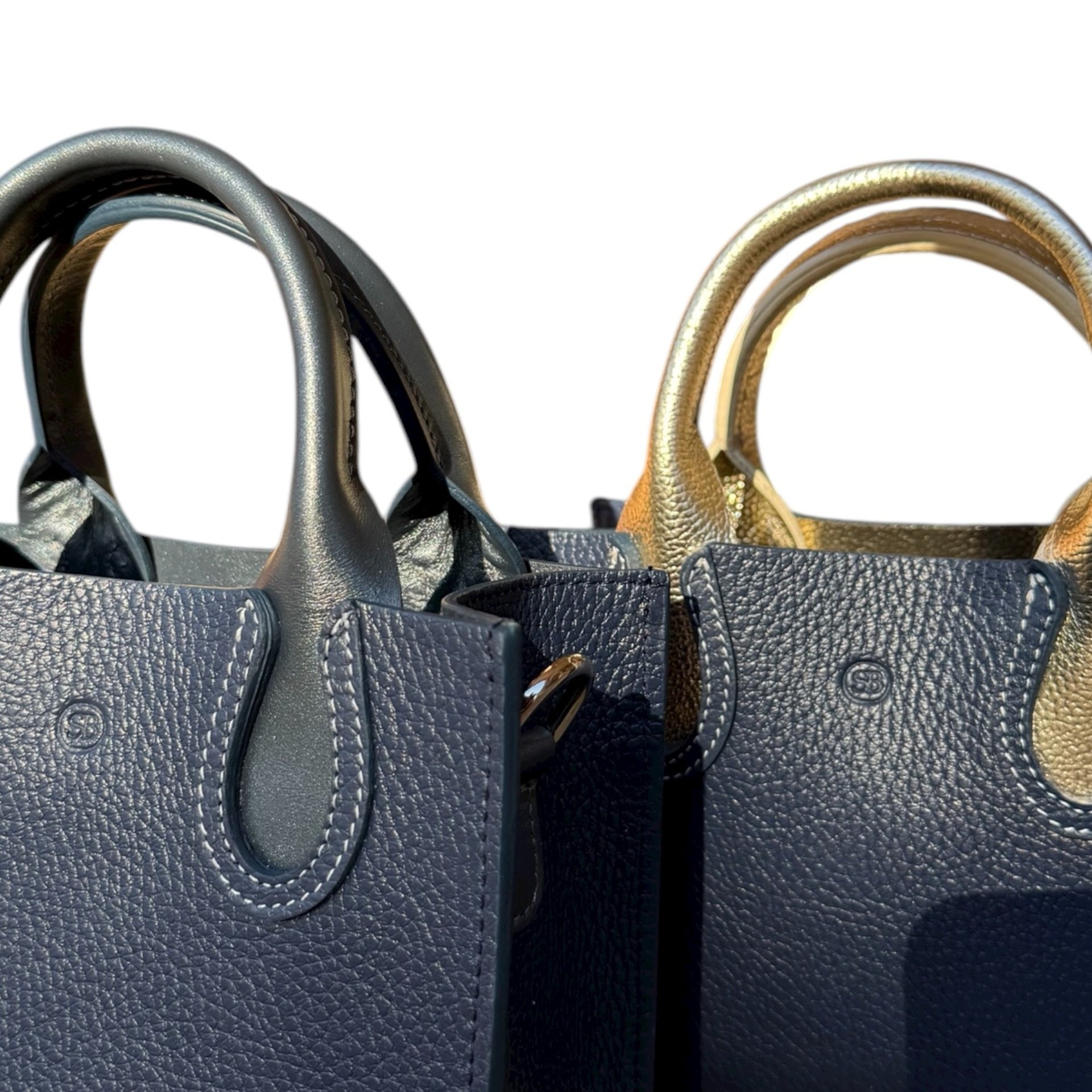 an abstract photo of a curved building with a blue sky in the background