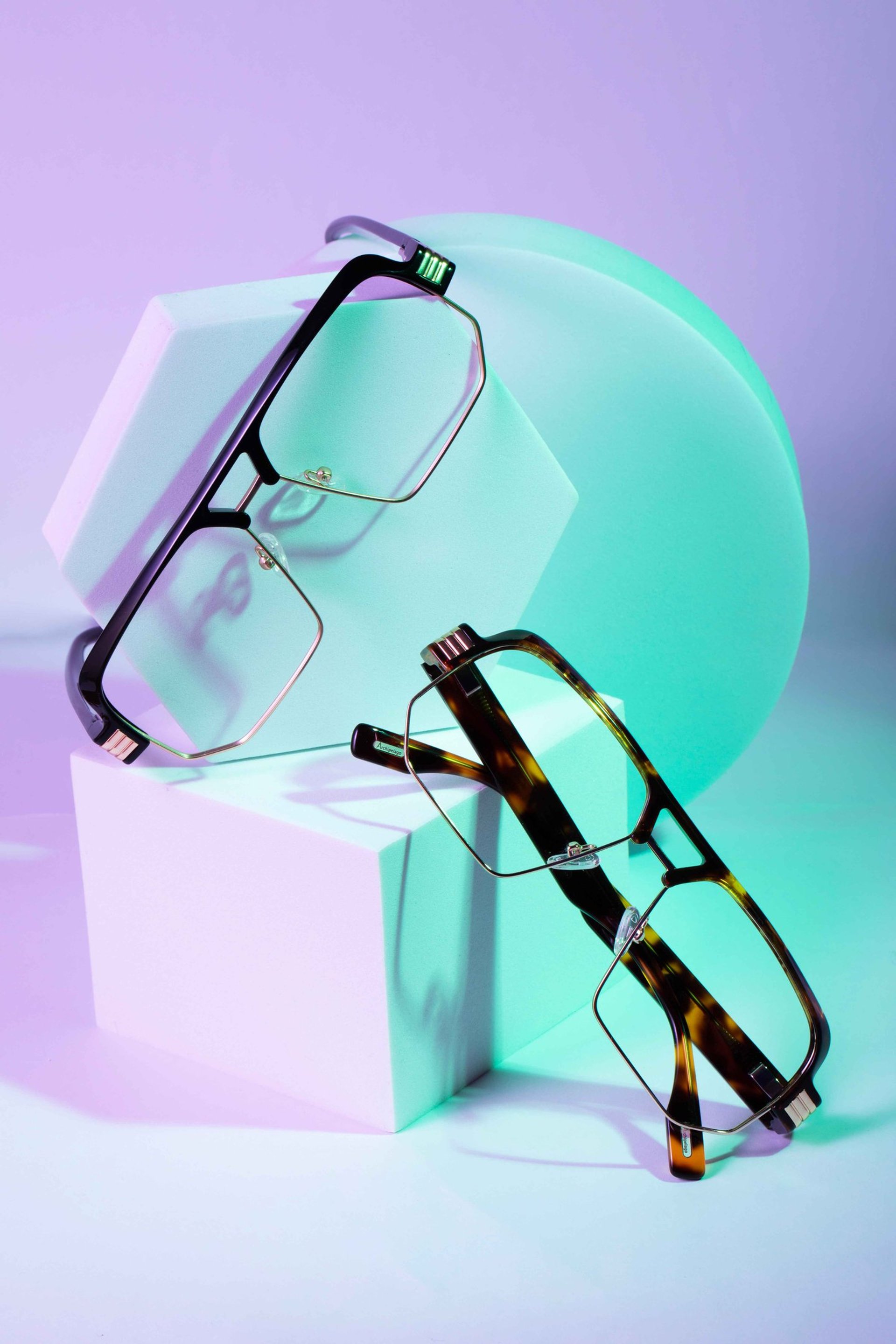 an abstract photo of a curved building with a blue sky in the background