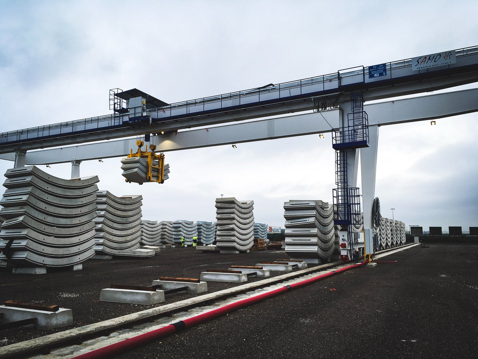 an abstract photo of a curved building with a blue sky in the background